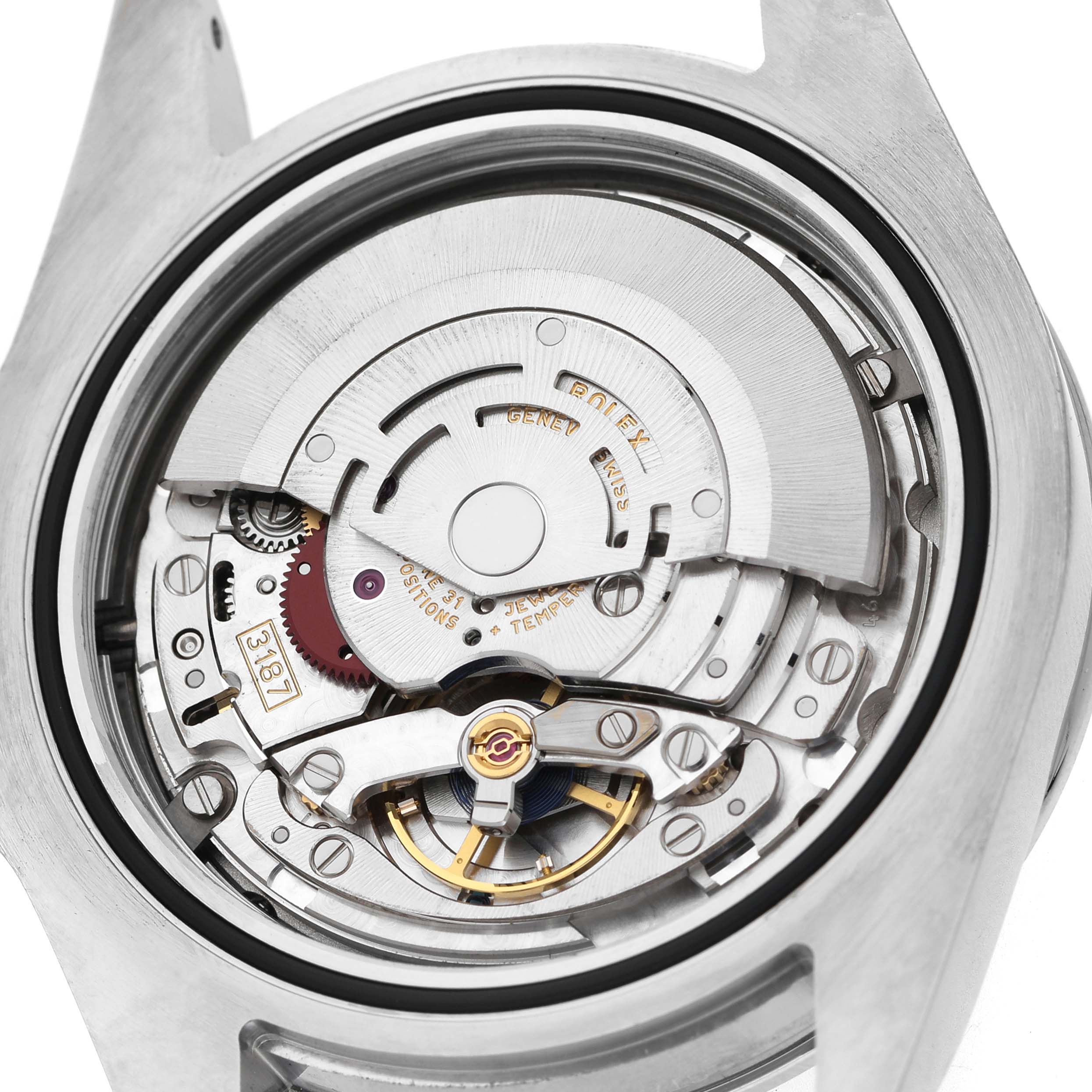 The image shows the back view of a Rolex Oyster Perpetual 216570 Men's Stainless Steel Black Dial, highlighting its intricate movement and components.