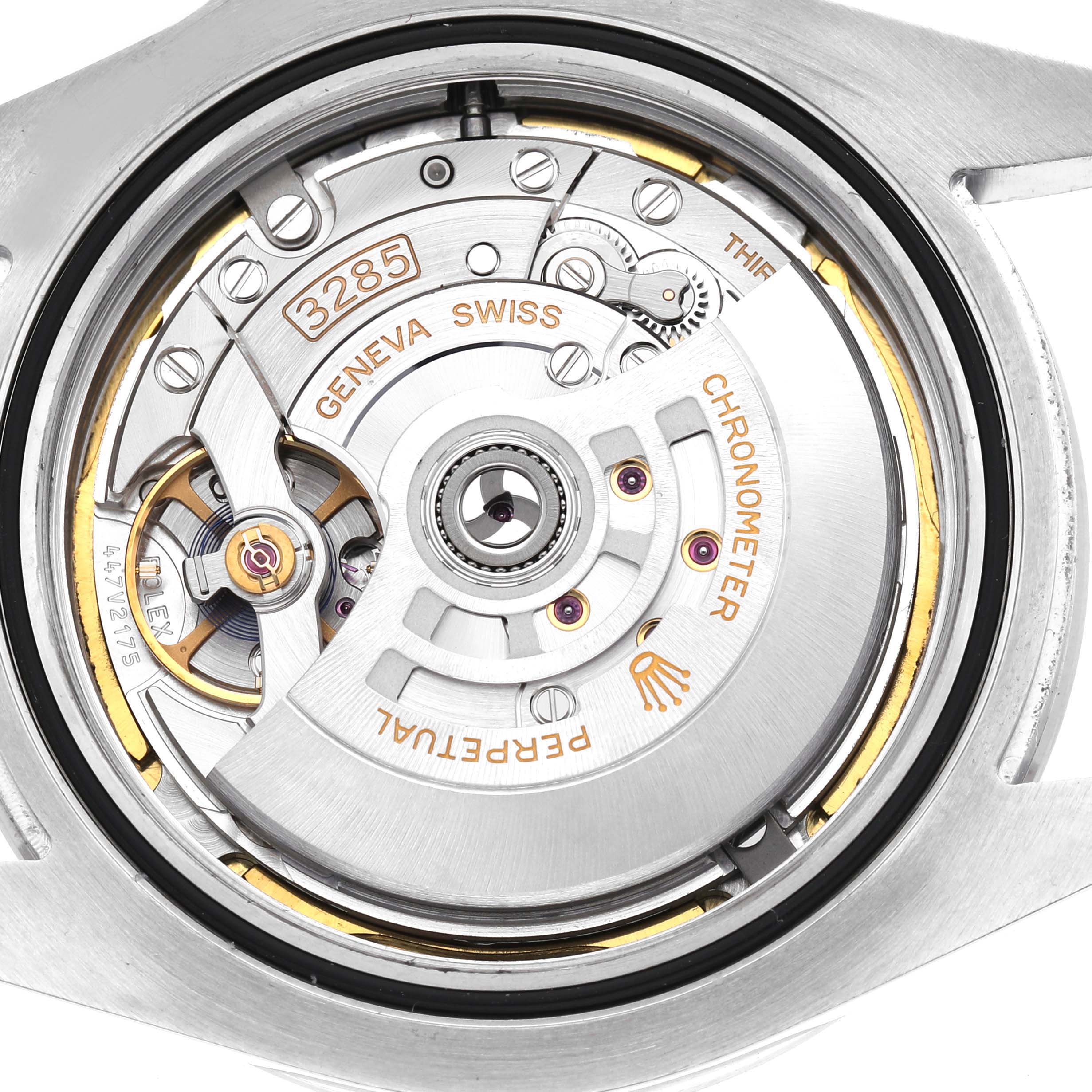 The image shows the back view of a Rolex Explorer 226570 Men's Stainless Steel Black Dial watch, highlighting its movement mechanism and inscriptions.