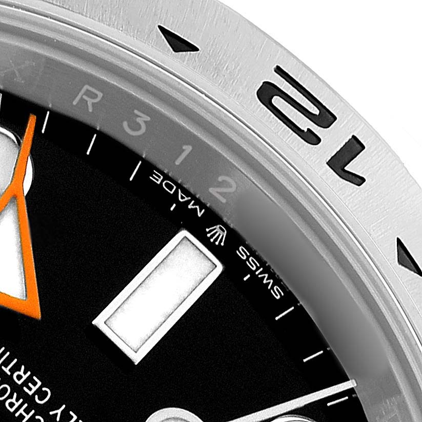 The image shows a close-up of the Rolex Explorer 226570 Men's Stainless Steel Black Dial watch, focusing on the bezel, part of the dial, and hands.