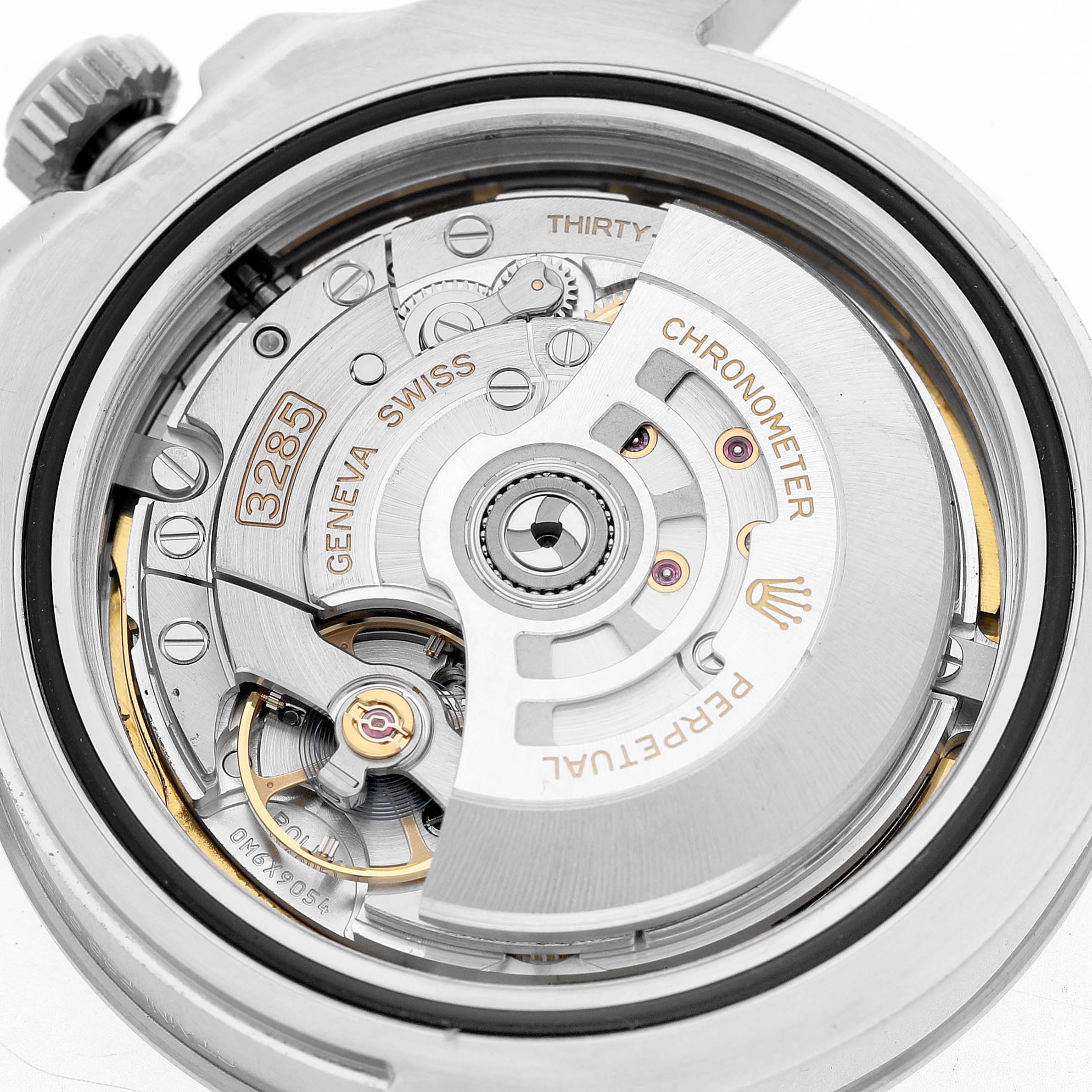 The image shows the Rolex Explorer 226570 Men's Stainless Steel Black Dial's movement (Caliber 3285) from the back, highlighting its gears and components.