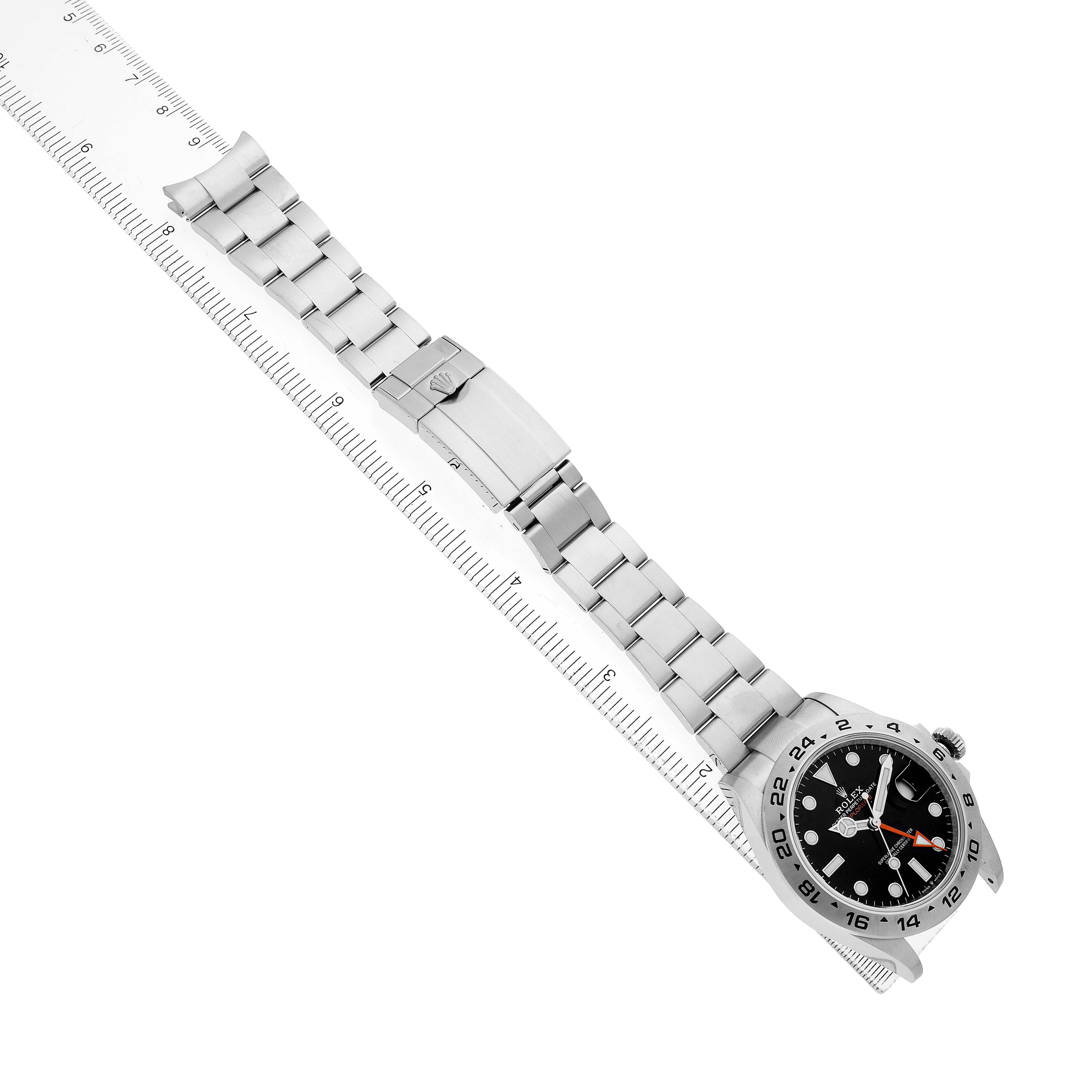 The Rolex Explorer 226570 Men's Stainless Steel Black Dial watch is shown from an overhead angle, featuring the bracelet and clasp along with the face and bezel.