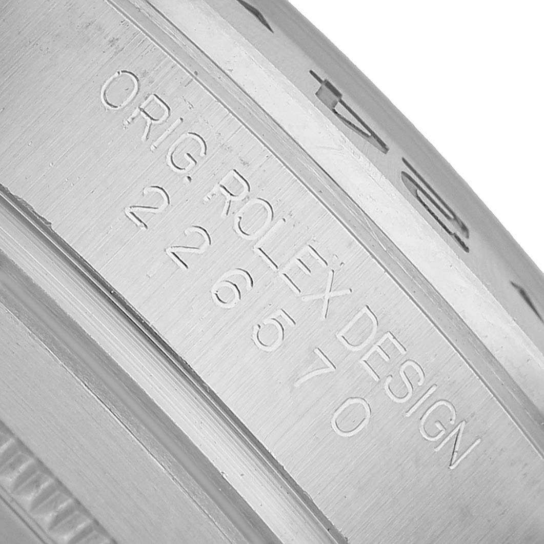 The image shows a close-up angle of the Rolex Explorer 226570 Men's Stainless Steel Black Dial model's engraved inner bezel with its design number.