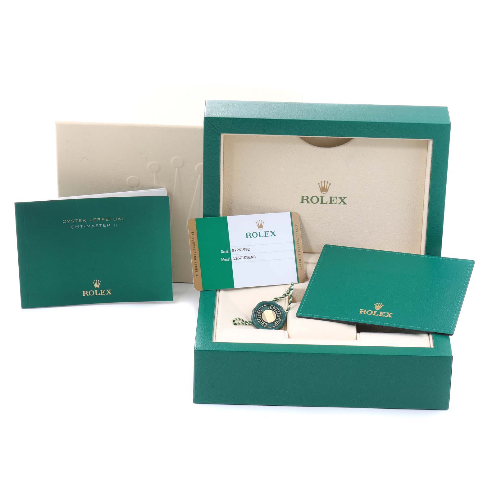 The image shows a Rolex GMT-Master 126710 Men's Stainless Steel Black Dial 126710 Men's Stainless Steel Black Dial watch box, warranty card, booklet, and tag from a frontal angle.