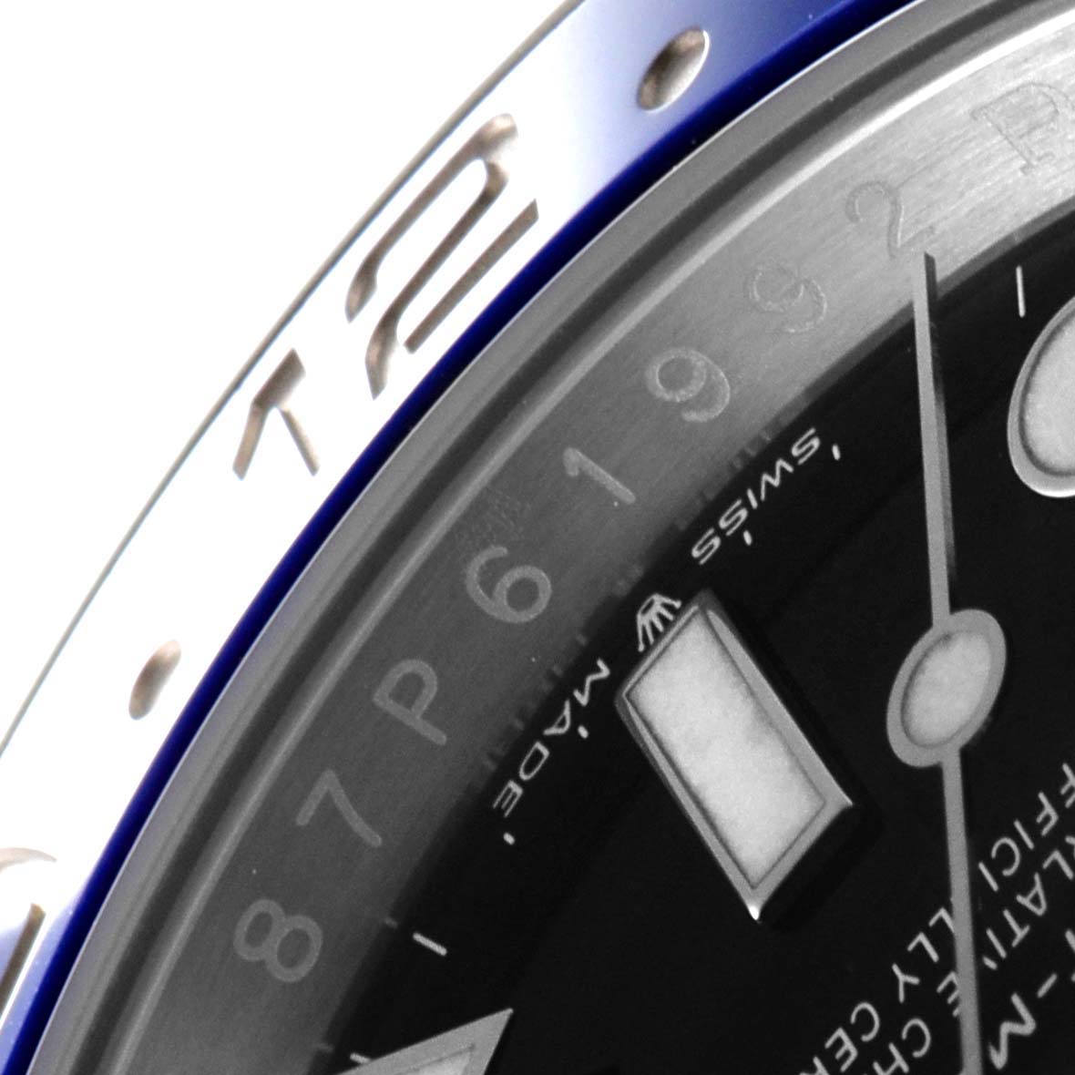 This close-up shows a portion of the bezel, dial, and hour markers of the Rolex GMT-Master 126710 Men's Stainless Steel Black Dial 126710 Men's Stainless Steel Black Dial watch.