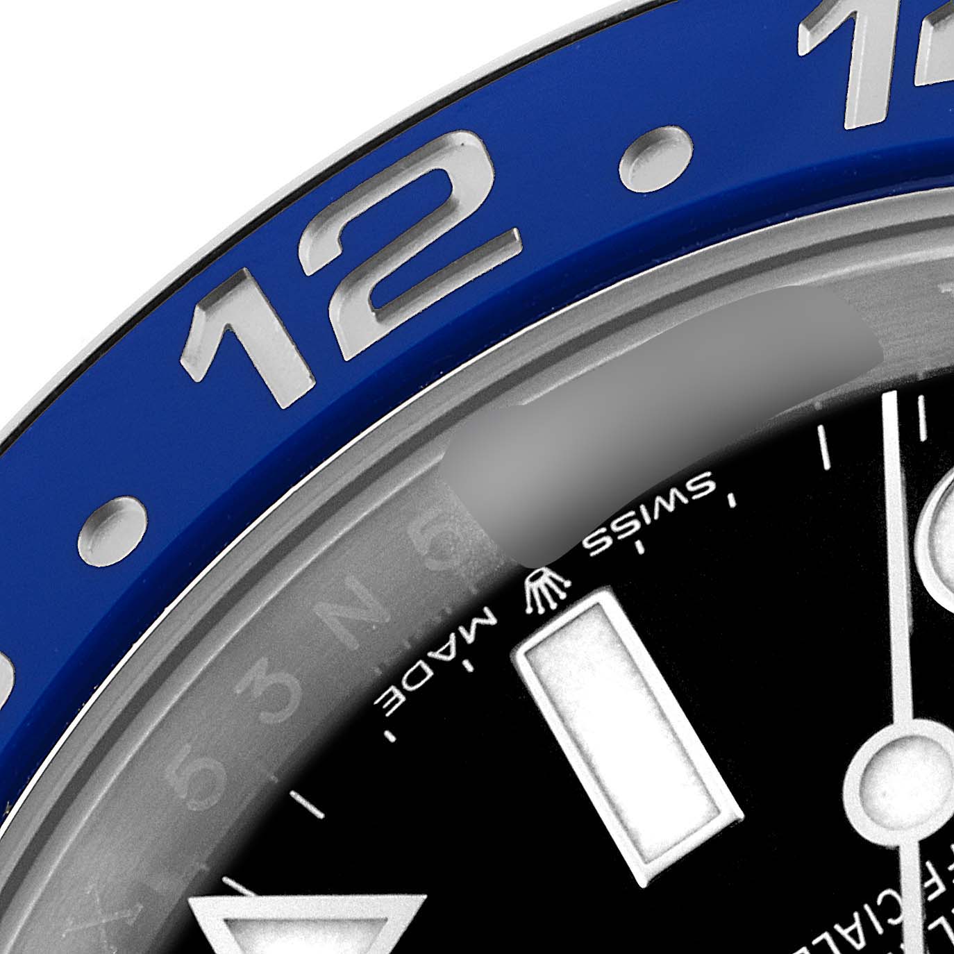 This image shows a close-up of the bezel and dial of a Rolex GMT-Master 126710 Men's Stainless Steel Black Dial 126710 Men's Stainless Steel Black Dial watch, including the "12" hour marker and "Swiss Made" text.