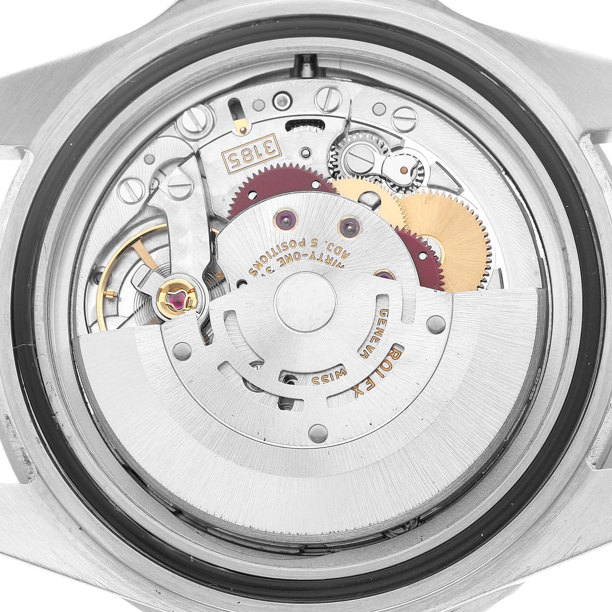 The image shows the movement of a Rolex GMT-Master 16710 Men's Stainless Steel Black Dial watch from a back perspective, highlighting gears and rotor.