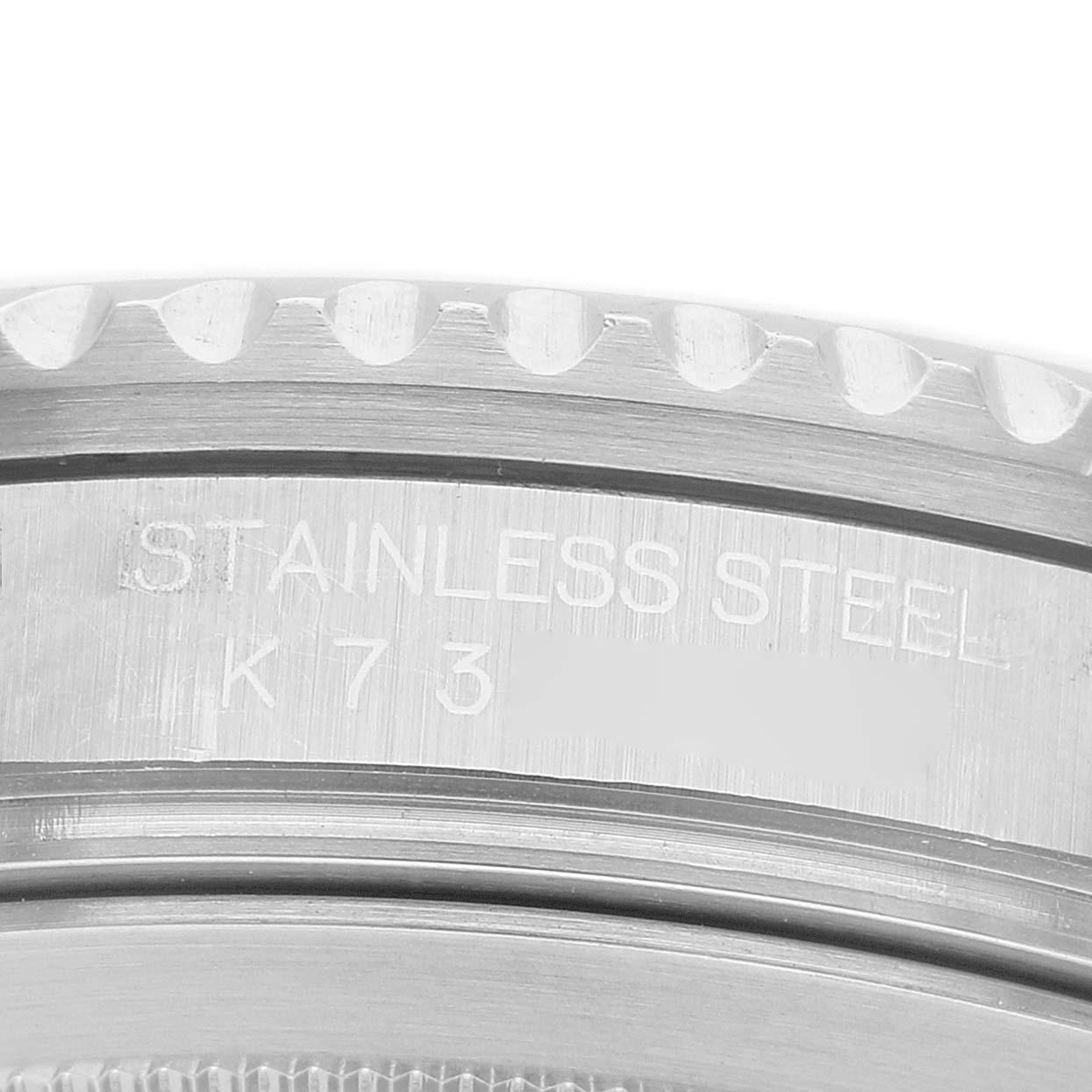 The image shows a close-up of the Rolex GMT-Master 16710 Men's Stainless Steel Black Dial model's stainless steel bezel with engraved markings.