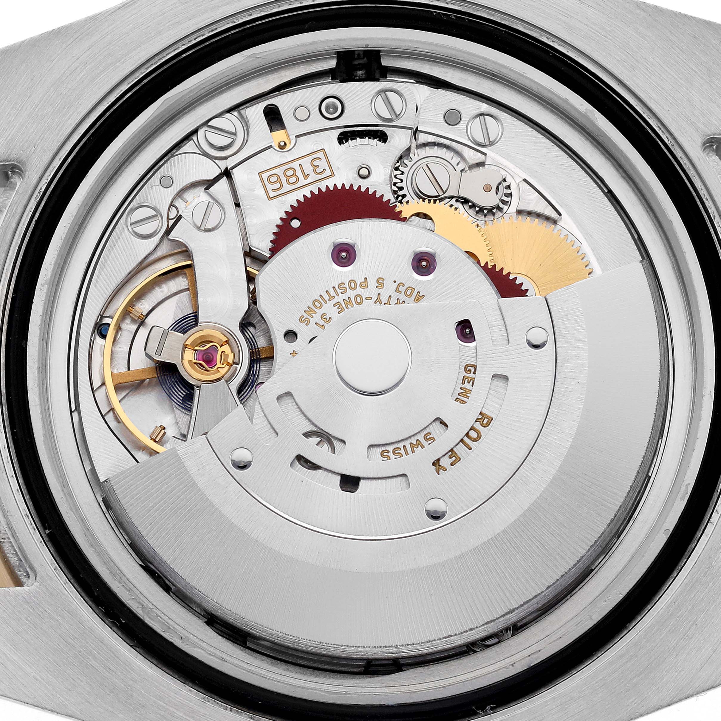 The image shows the internal movement of a Rolex GMT-Master 116713LN Men's Steel and Gold (two tone) Black Dial 116713LN Men's Steel and Gold (two tone) Black Dial watch from a rear angle, highlighting gears and the rotor.