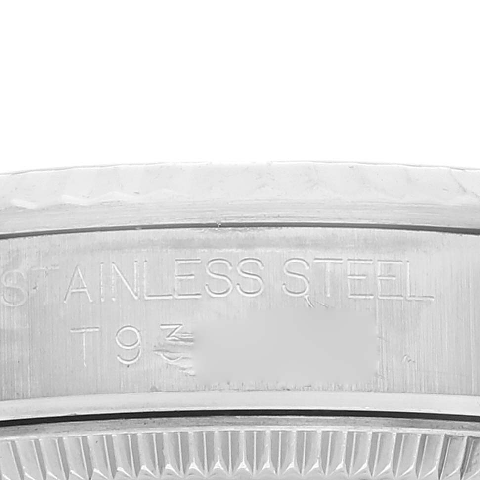 This image showcases a close-up of the side of the bezel and case of a Rolex Mid-Size 67514 Women
s Stainless Steel Blue Dial 67514 Women
s Stainless Steel Blue Dial model, highlighting its stainless steel construction.