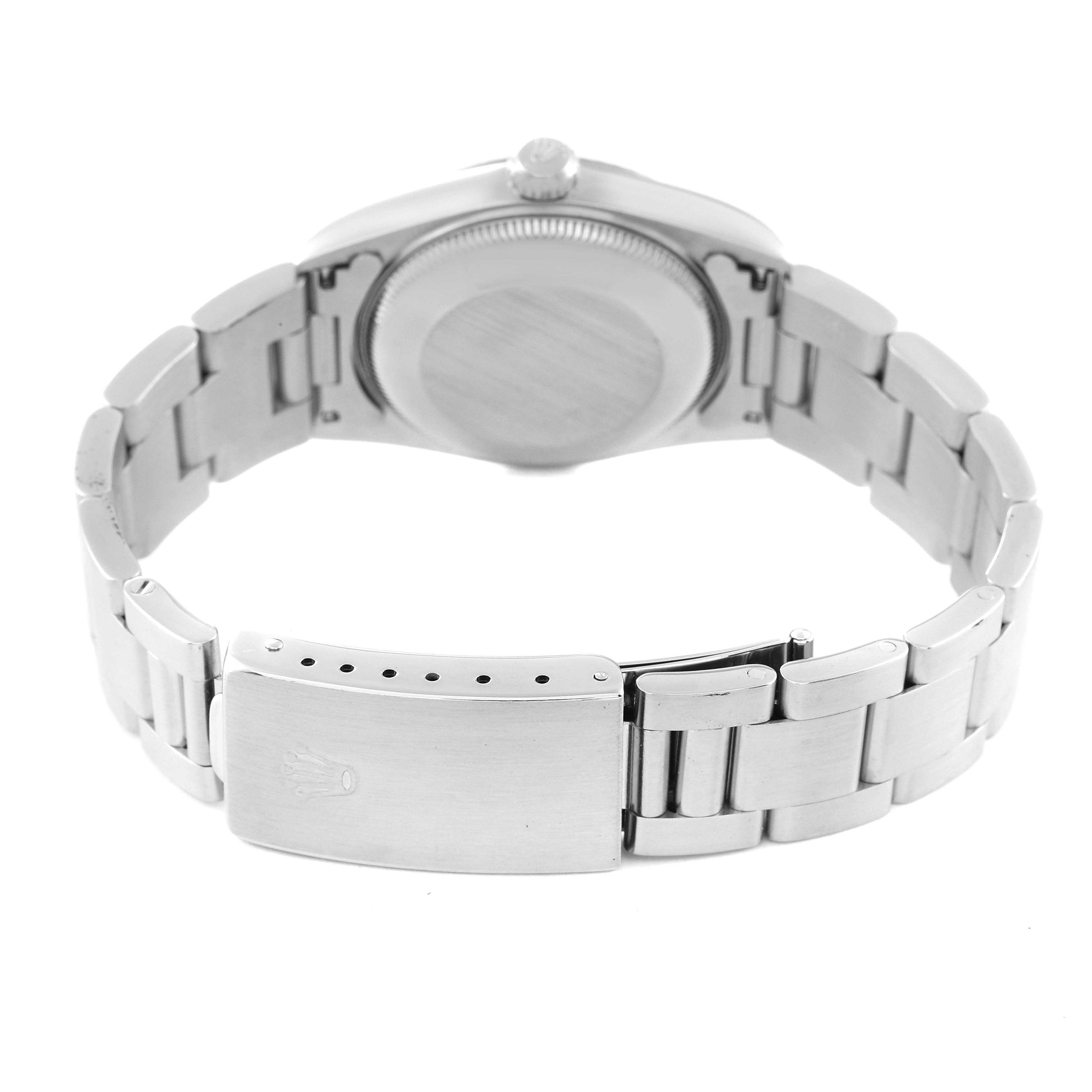 The image shows the back and bracelet of a Mid-Size Rolex watch, including the clasp and case back.