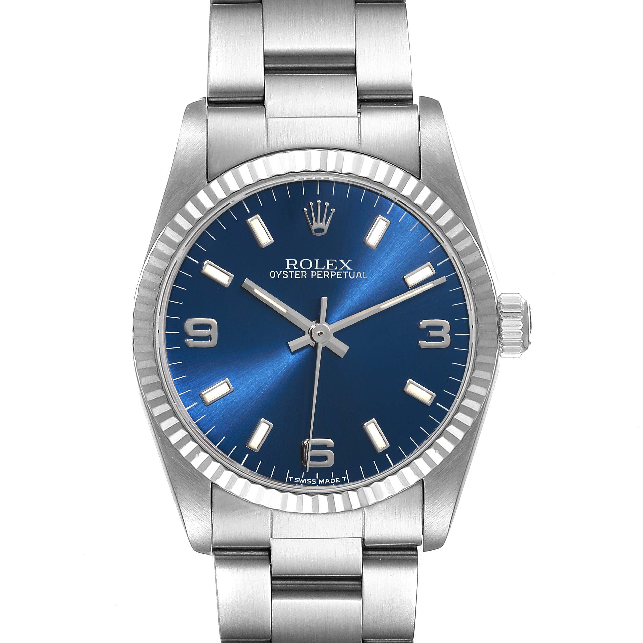 The image shows a frontal view of a Rolex Oyster Perpetual Mid-Size watch with a blue dial and steel bracelet.