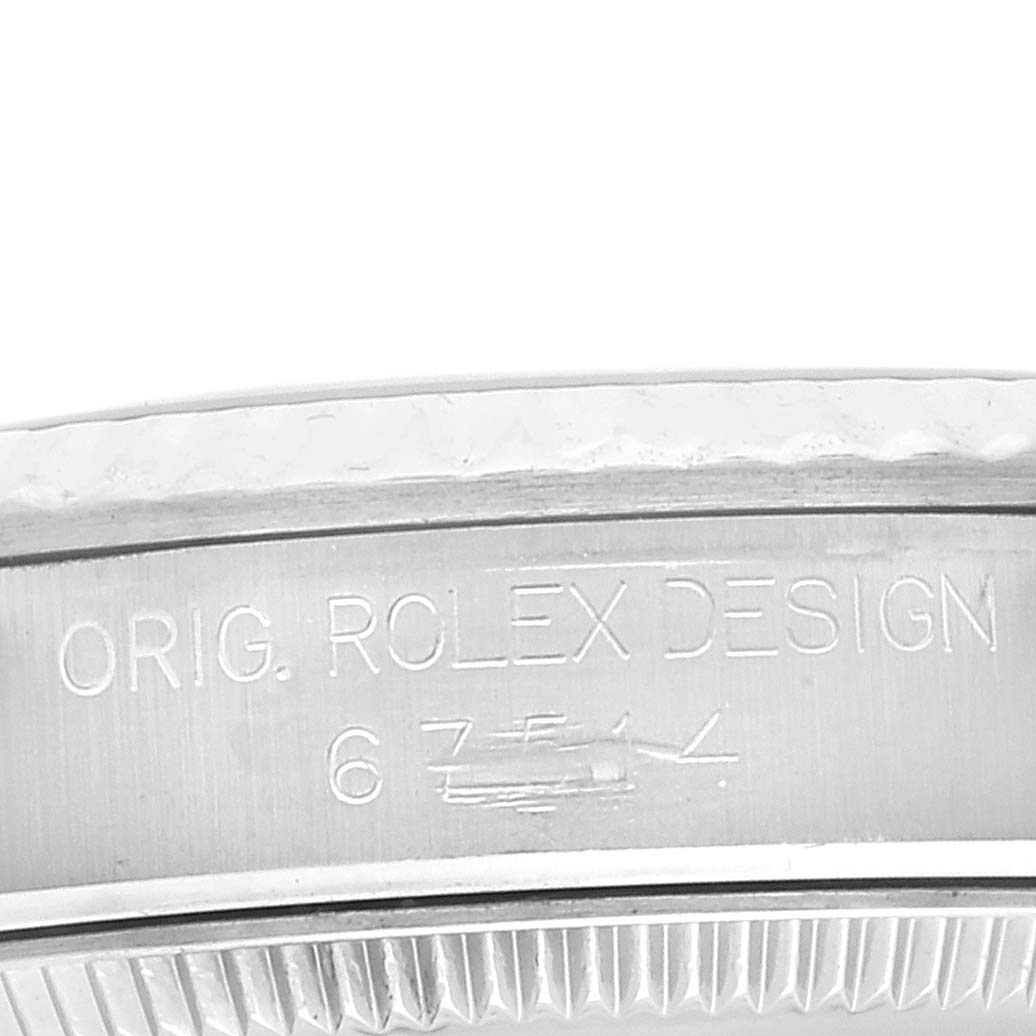 The image shows a close-up of the case edge of a mid-size Rolex watch with the engraving "ORIG. ROLEX DESIGN".