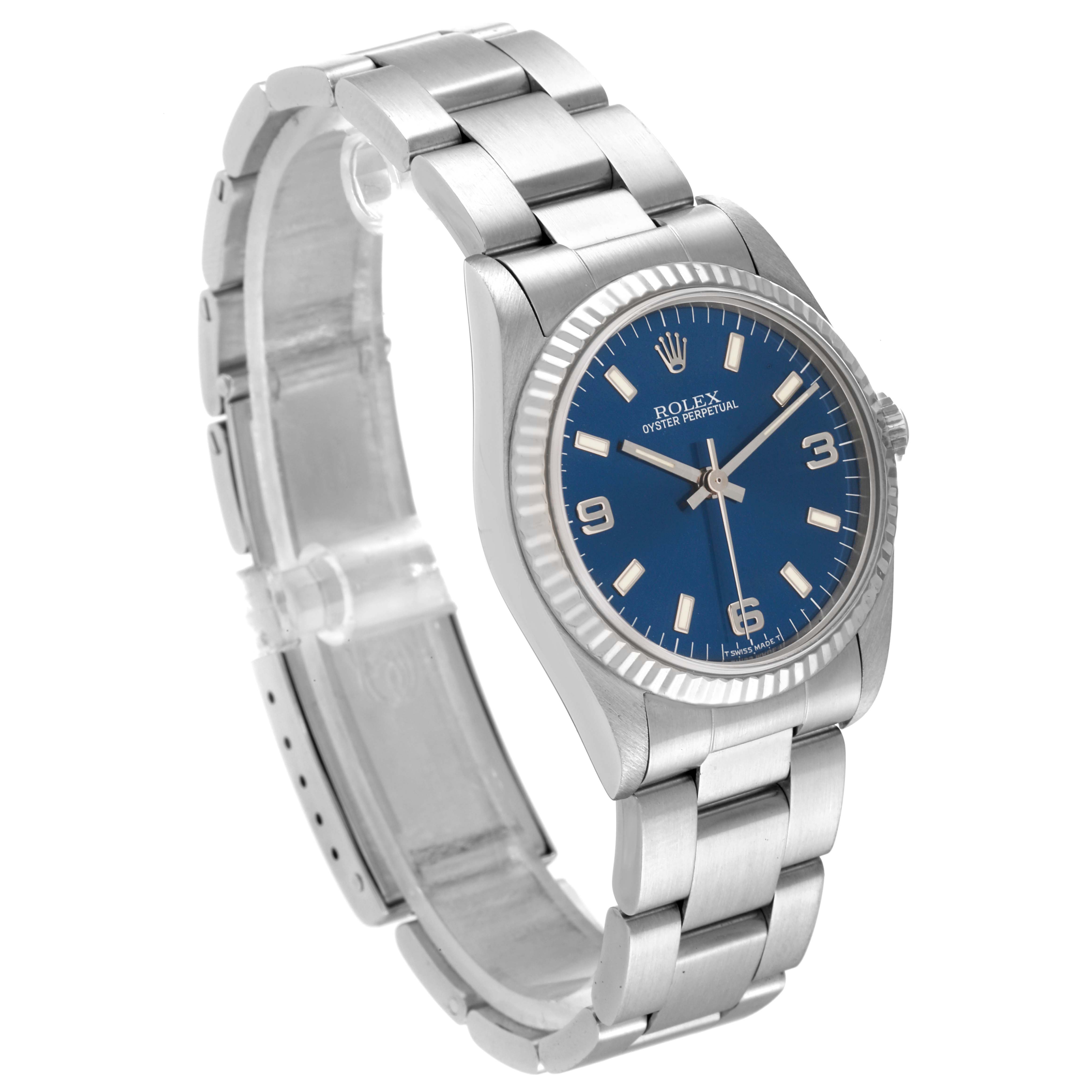 This image shows a side and front angle of a Rolex Mid-Size 67514 Women
s Stainless Steel Blue Dial 67514 Women
s Stainless Steel Blue Dial model watch with a blue dial and silver bracelet.