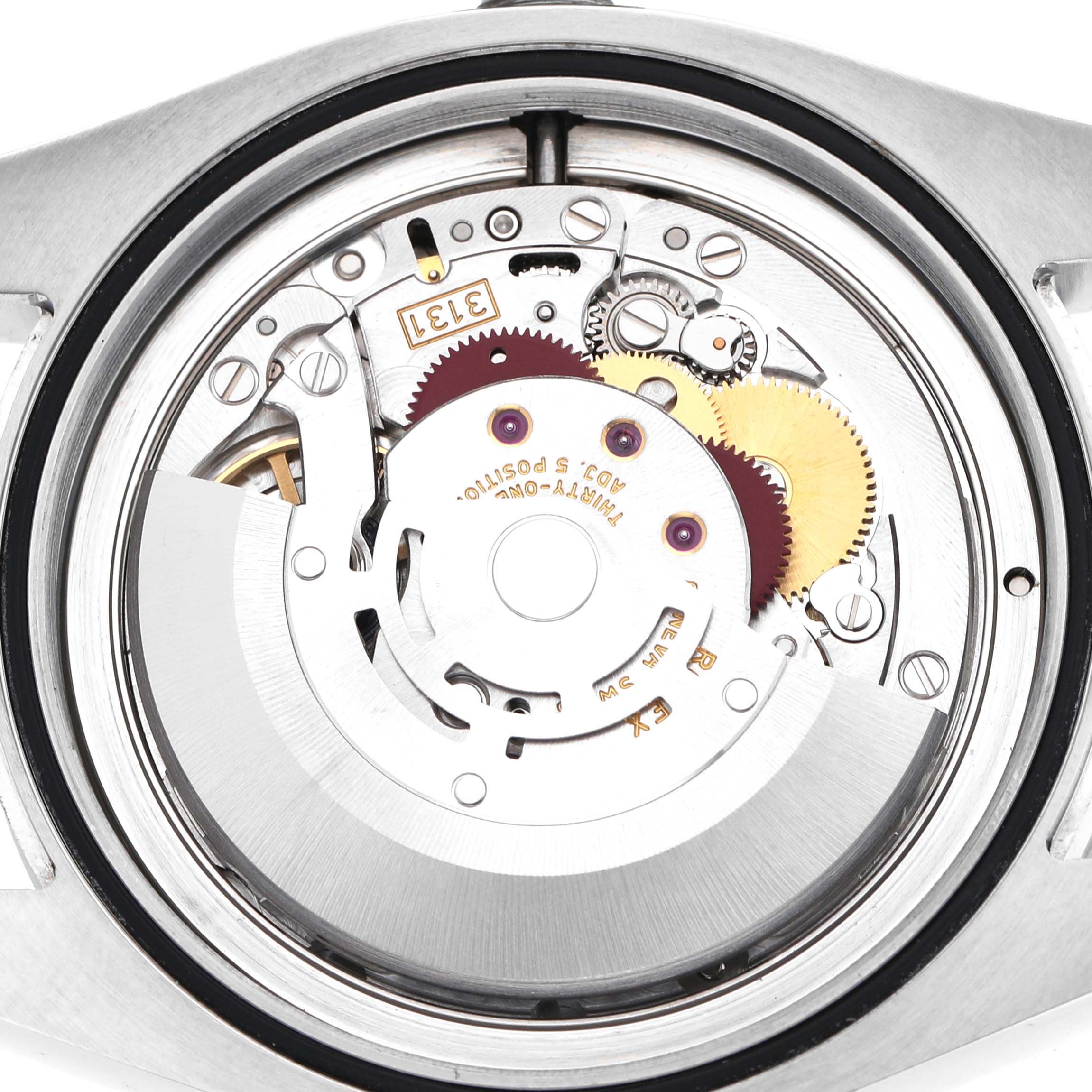 The image shows a close-up view of the Rolex Milgauss 116400GV Men's Stainless Steel Black Dial movement, highlighting gears and internal mechanisms.