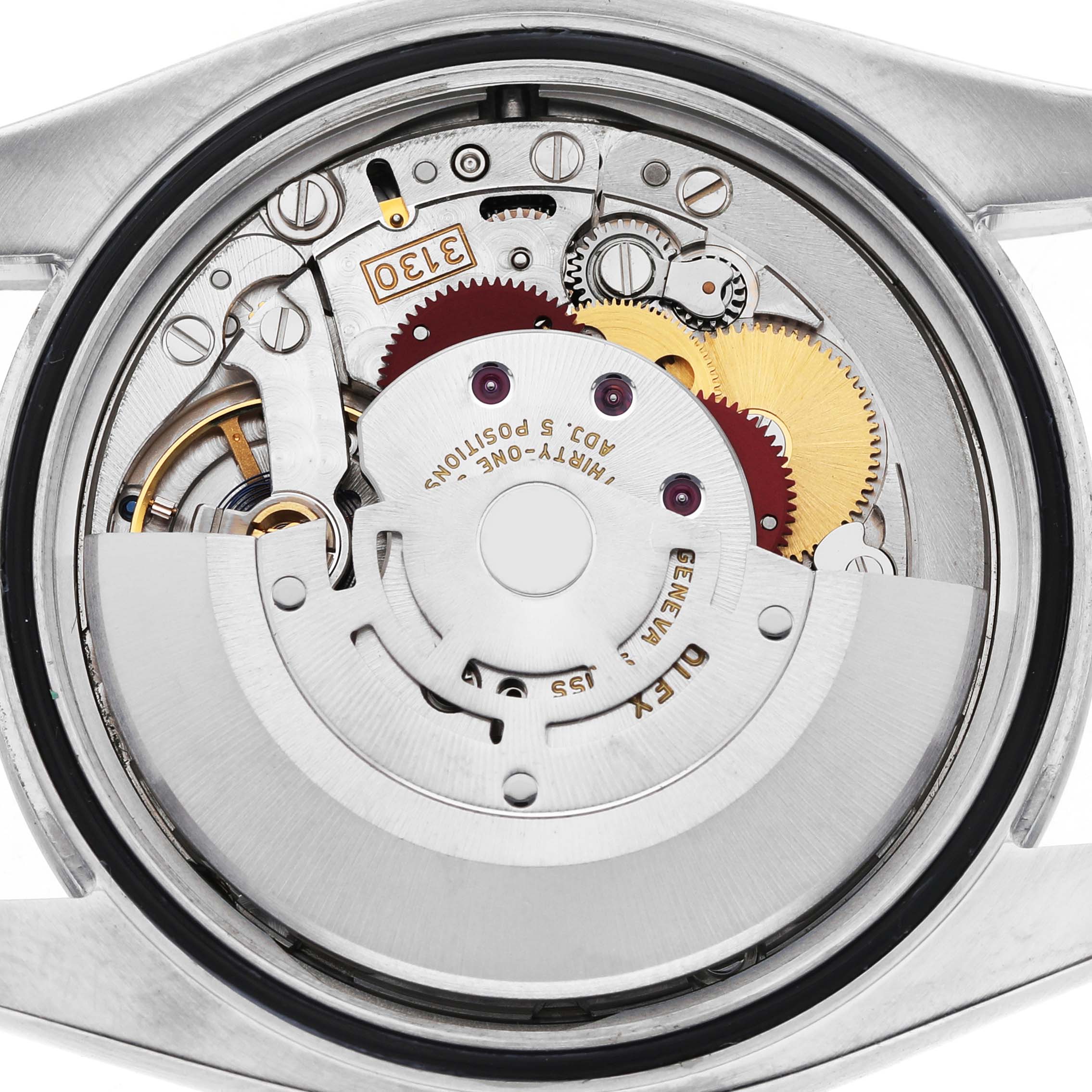 The image shows the inner mechanics of a Rolex Oyster Perpetual 116000 Men's Stainless Steel Silver Dial watch, featuring the movement and gears from a top-down angle.