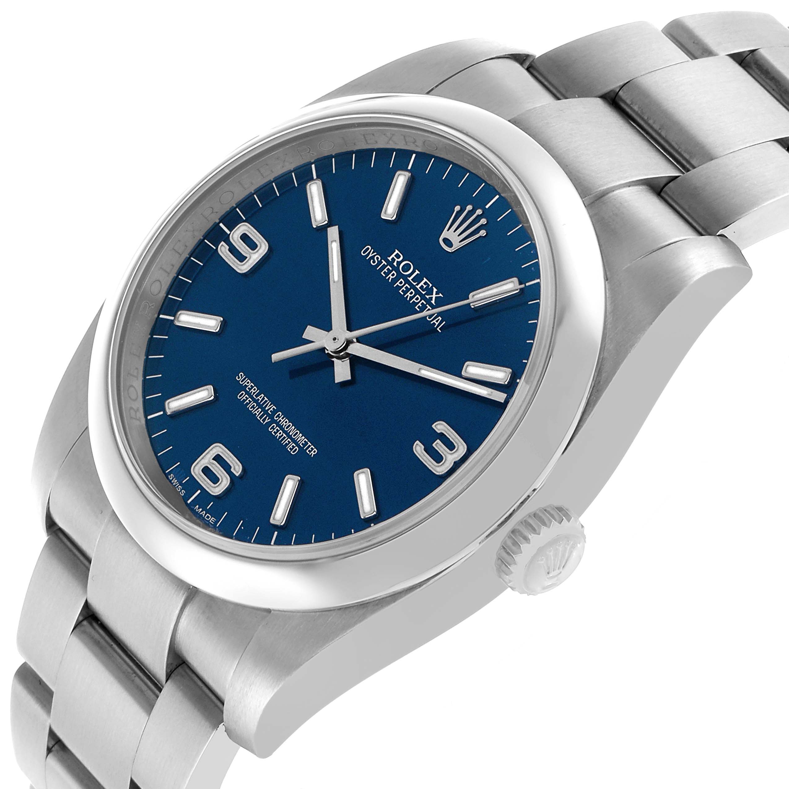 The Rolex Oyster Perpetual 116000 Men's Stainless Steel Blue Dial watch is shown at a slight angle, highlighting the dial, bezel, crown, and bracelet.
