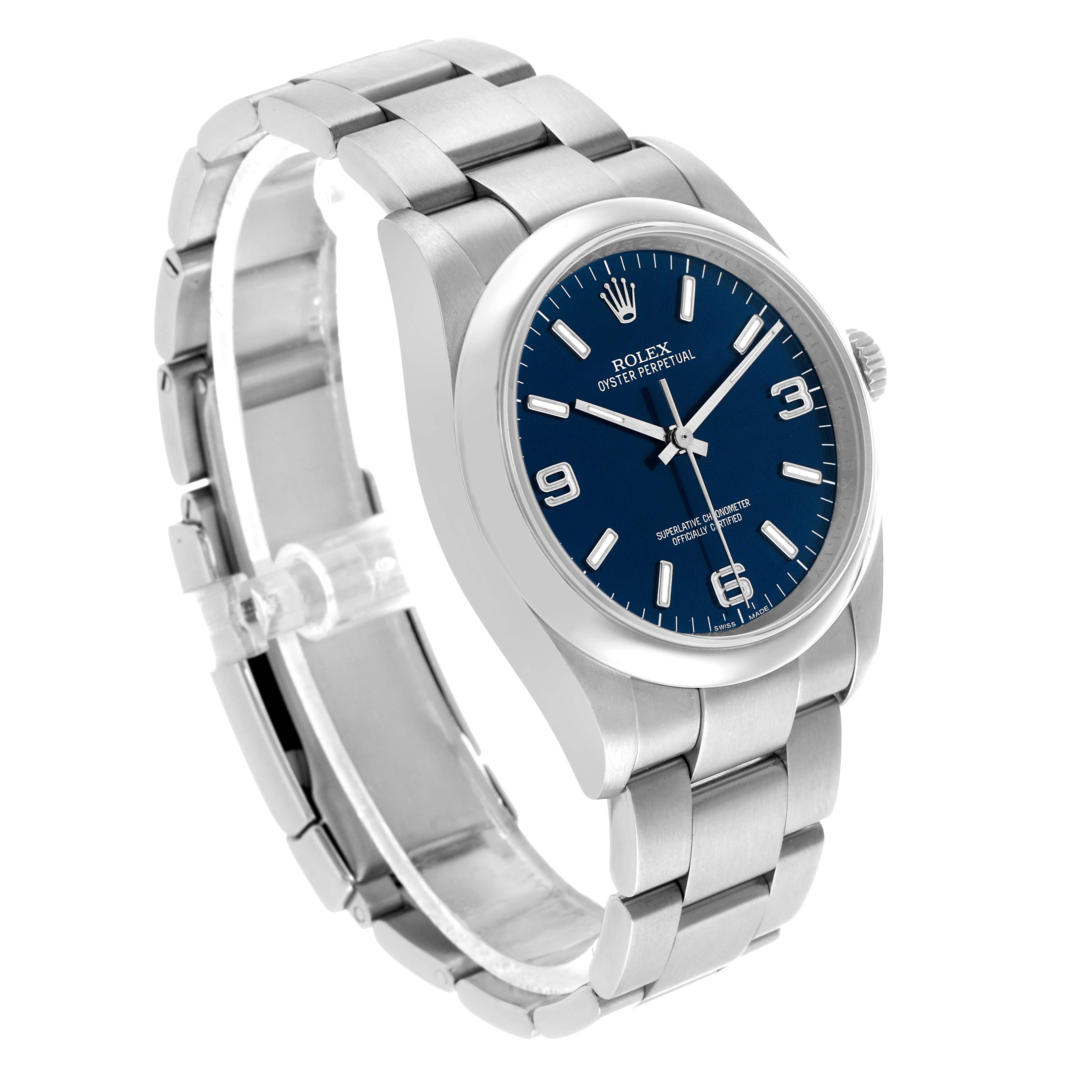 The Rolex Oyster Perpetual 116000 Men's Stainless Steel Blue Dial watch is shown at an angle highlighting its stainless steel bracelet and blue dial.