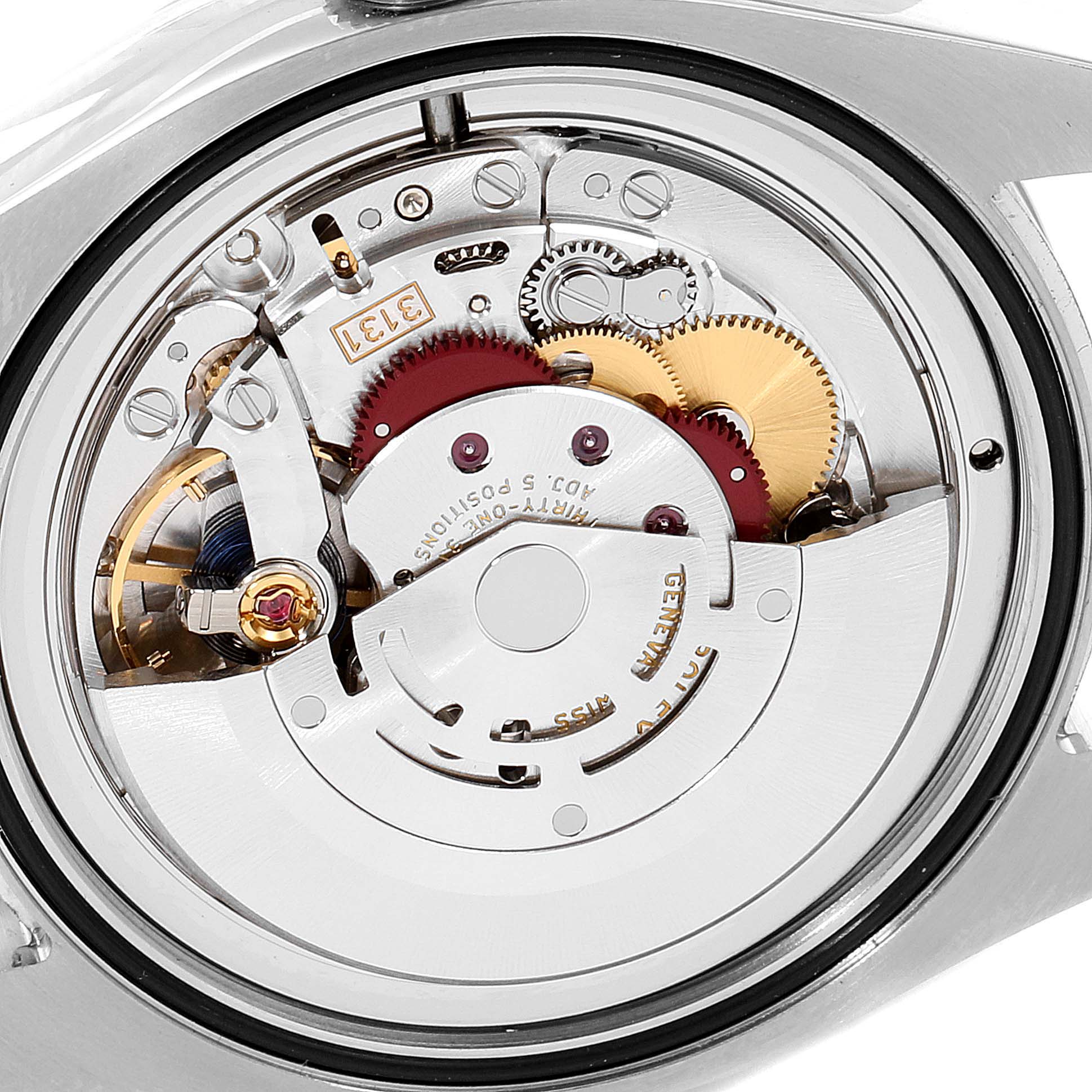 This is an image of the internal mechanism of an Air-King Rolex watch, showing gears and the movement components.
