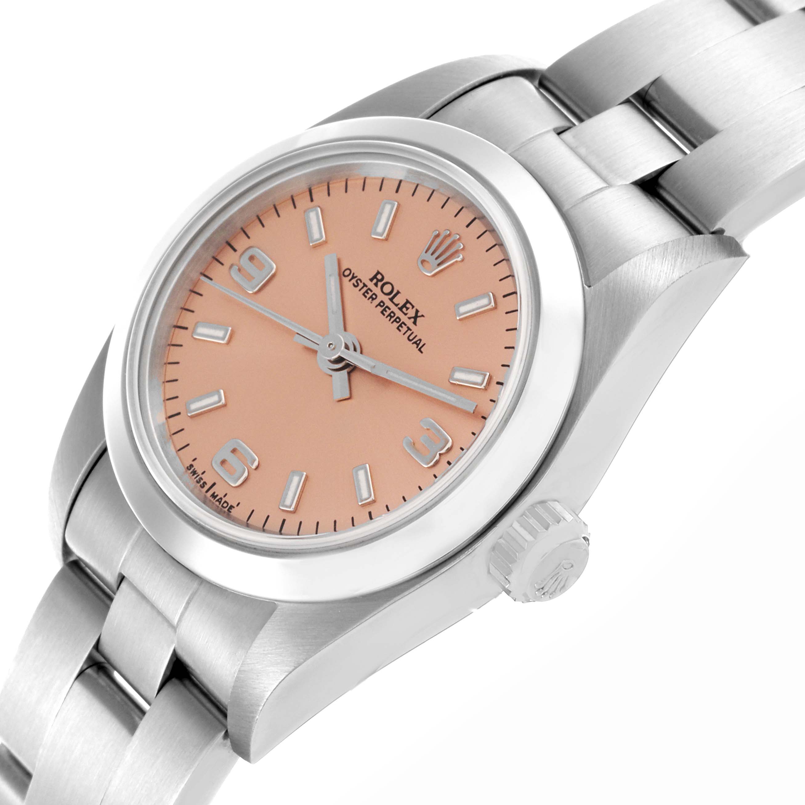 The Rolex Oyster Perpetual 76080 Women's Stainless Steel Pink Dial 76080 Women's Stainless Steel Pink Dial is shown at an angle highlighting the dial, bezel, crown, and a portion of the bracelet.