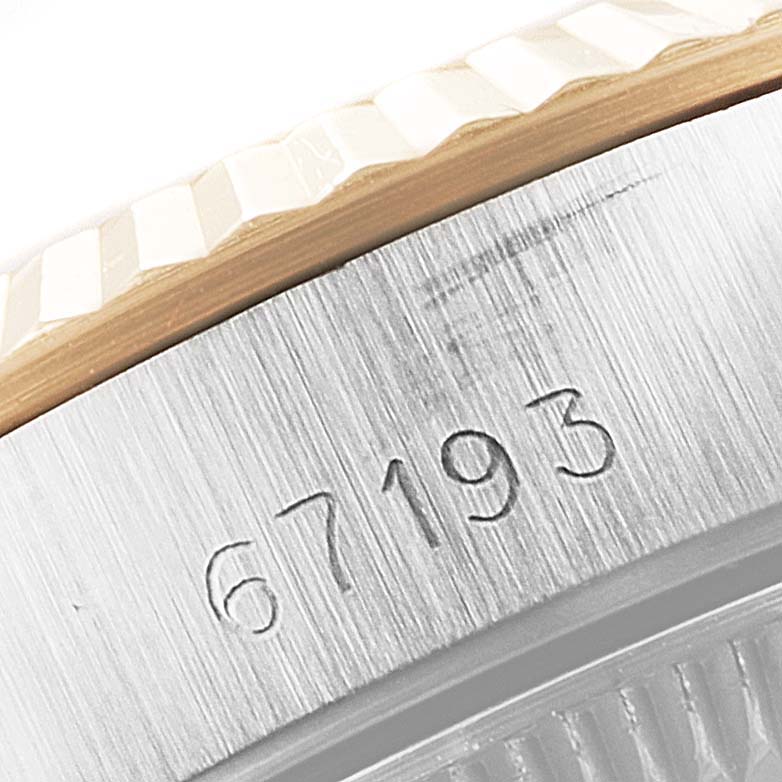 This image shows the engraved reference number on the side of the case of a Rolex Oyster Perpetual 67193 Women's Steel and Gold (two tone) Champagne Dial 67193 Women's Steel and Gold (two tone) Champagne Dial watch.