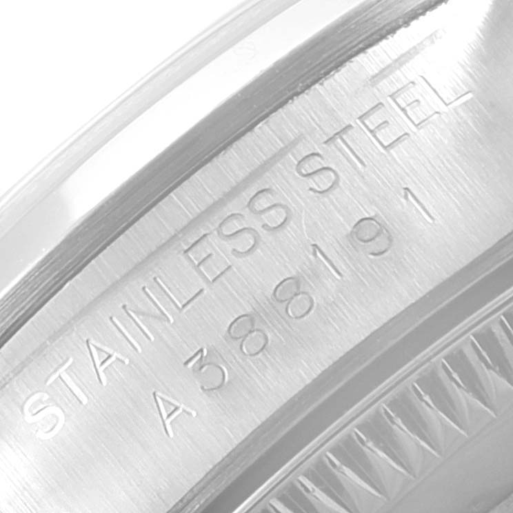 This close-up image of the Rolex Oyster Perpetual 76080 Women
s Stainless Steel Pink Dial 76080 Women
s Stainless Steel Pink Dial watch shows the engraved details on the stainless steel case.