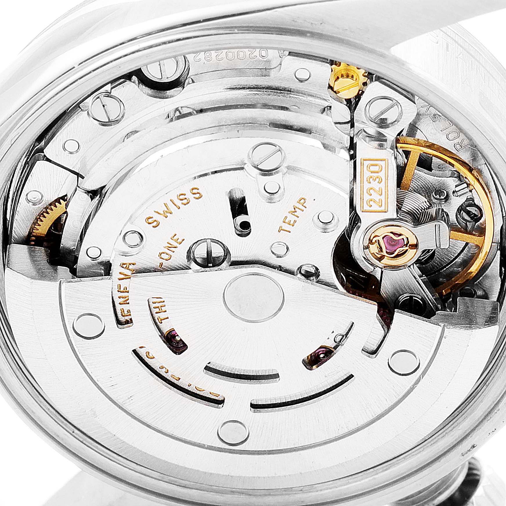 The image shows a close-up of the movement mechanism inside a Rolex Oyster Perpetual 76080 Women
s Stainless Steel Pink Dial 76080 Women
s Stainless Steel Pink Dial watch.