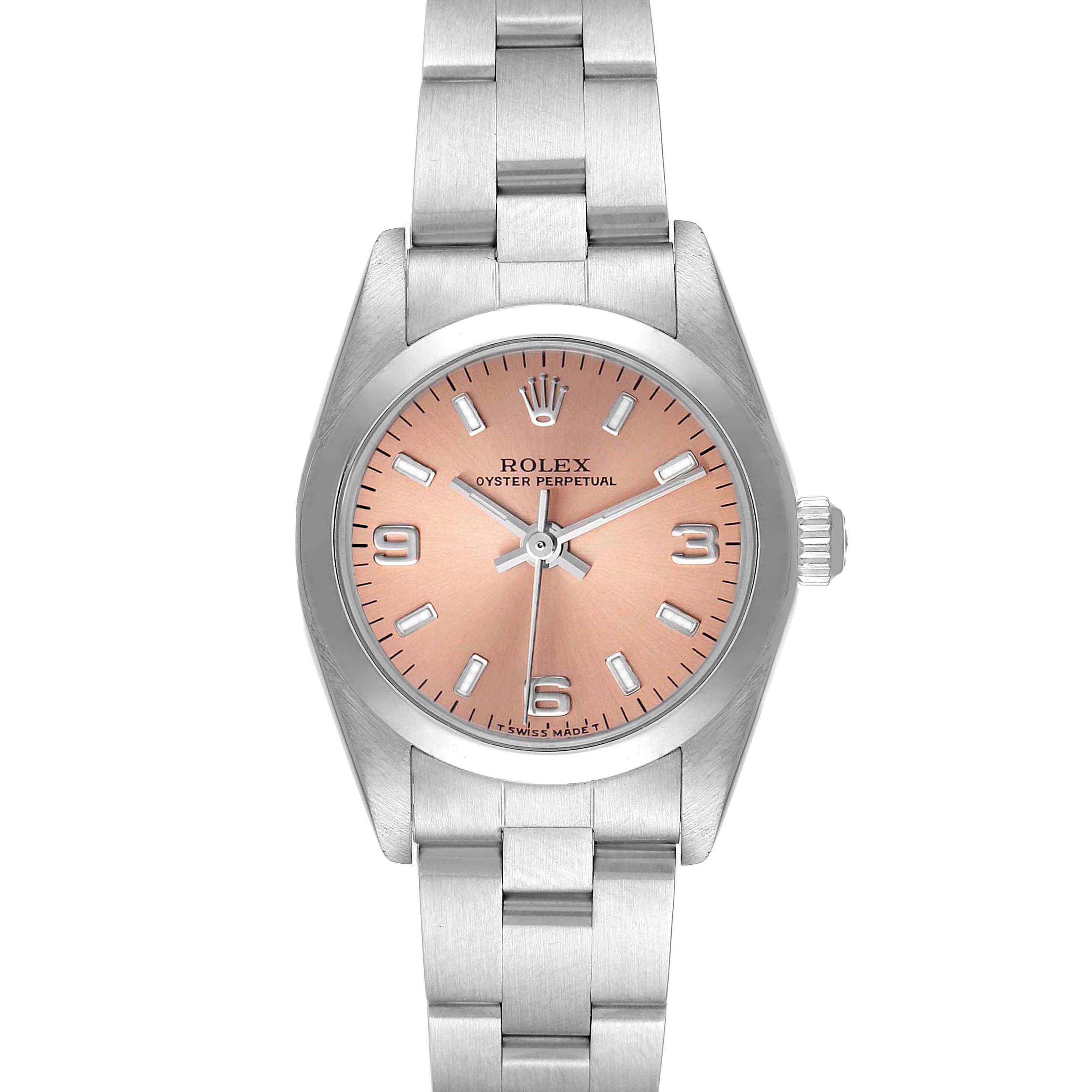 The image shows a front view of the Rolex Oyster Perpetual 76080 Women
s Stainless Steel Pink Dial 76080 Women
s Stainless Steel Pink Dial watch, highlighting its pink dial, stainless steel case, and bracelet.