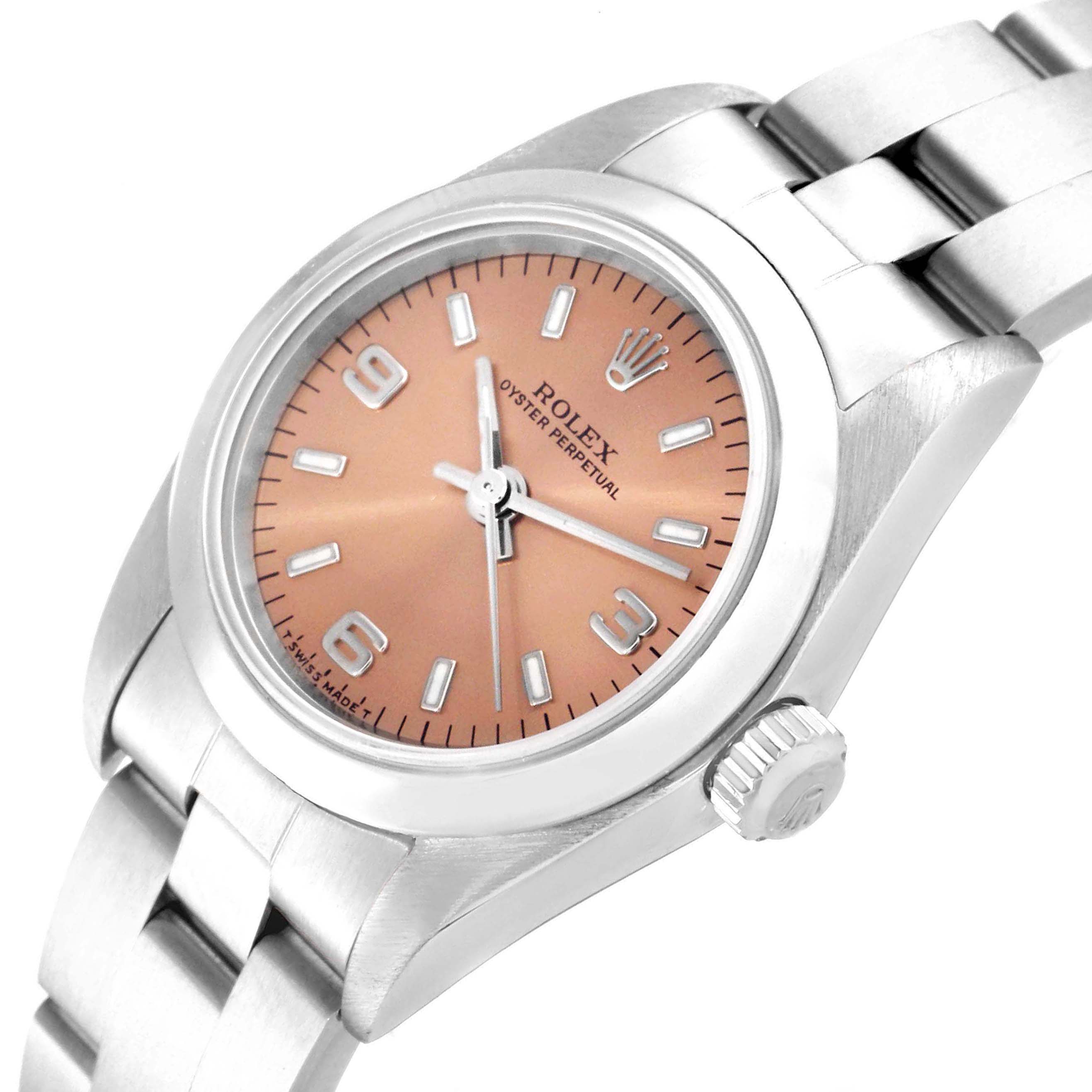 The Rolex Oyster Perpetual 76080 Women
s Stainless Steel Pink Dial 76080 Women
s Stainless Steel Pink Dial watch is displayed at an angle showing its dial, bezel, crown, and bracelet.