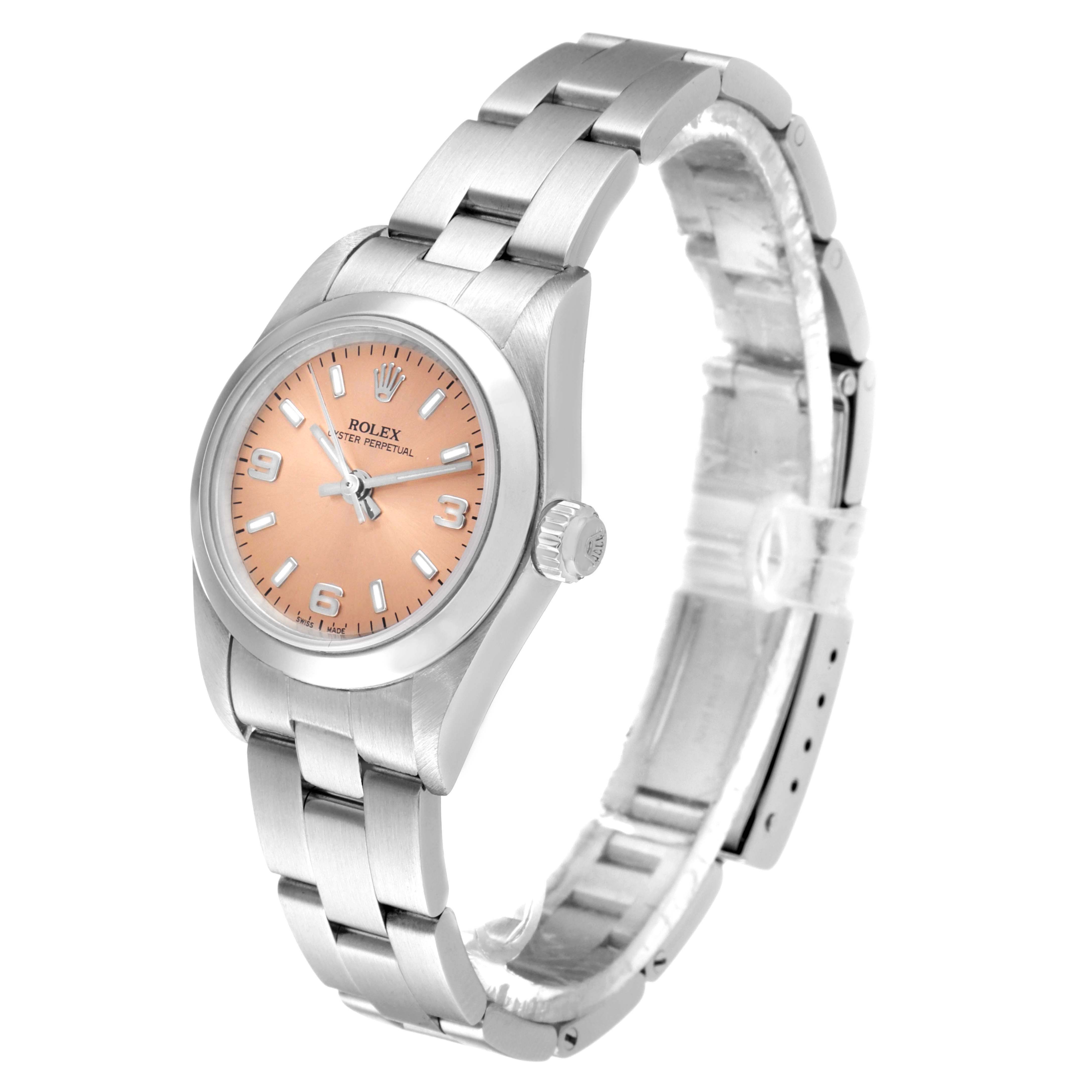 The image shows a Rolex Oyster Perpetual 76080 Women's Stainless Steel Pink Dial 76080 Women's Stainless Steel Pink Dial watch at a three-quarter angle, highlighting its face, bezel, and bracelet.