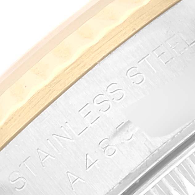 The image shows a close-up of the outer edge of a Rolex Oyster Perpetual 76193 Women's Steel and Gold (two tone) Champagne Dial 76193 Women's Steel and Gold (two tone) Champagne Dial watch, highlighting the "STAINLESS STEEL" text.