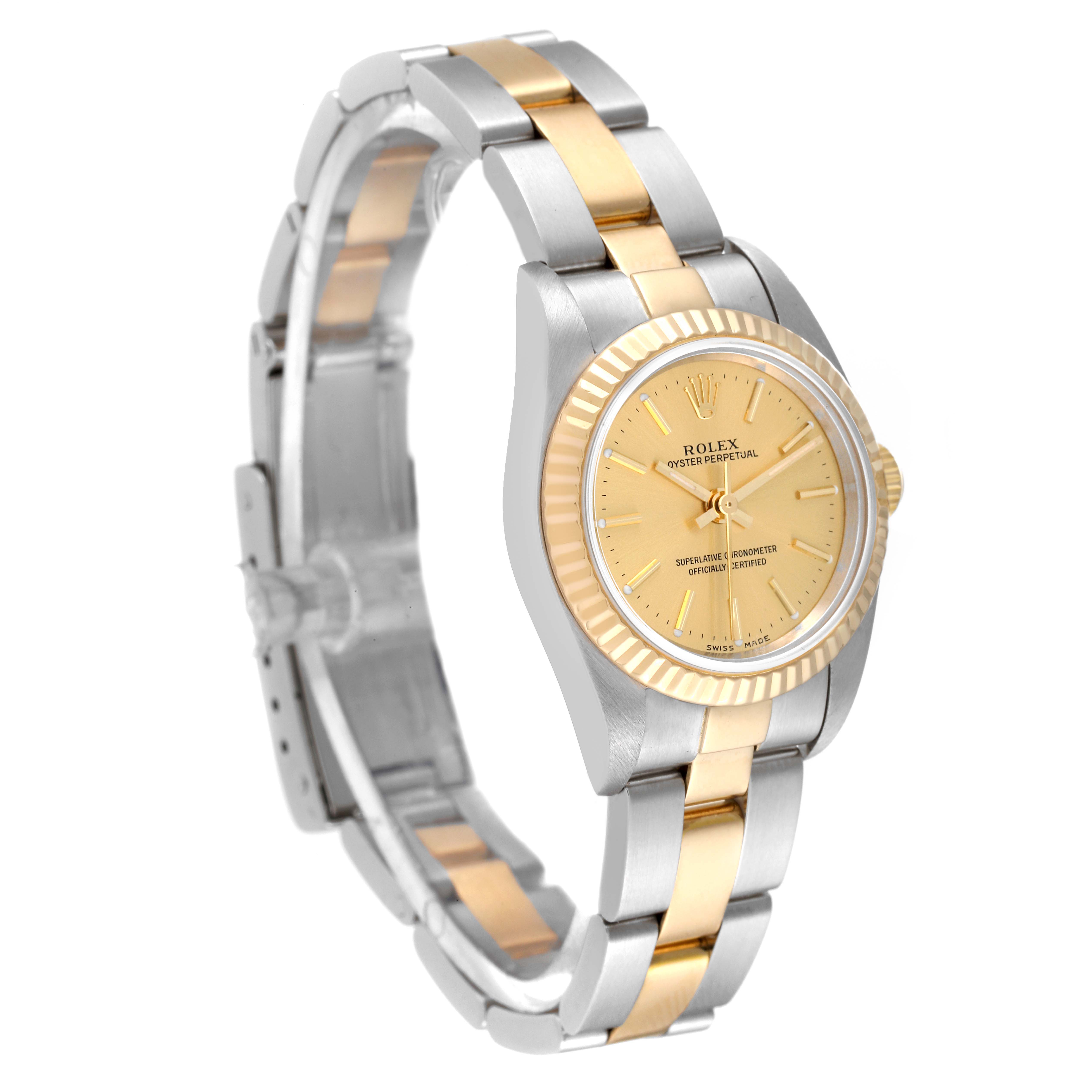 The Rolex Oyster Perpetual 76193 Women's Steel and Gold (two tone) Champagne Dial 76193 Women's Steel and Gold (two tone) Champagne Dial watch is shown at a slight angle featuring its gold dial, two-tone bracelet, and fluted bezel.