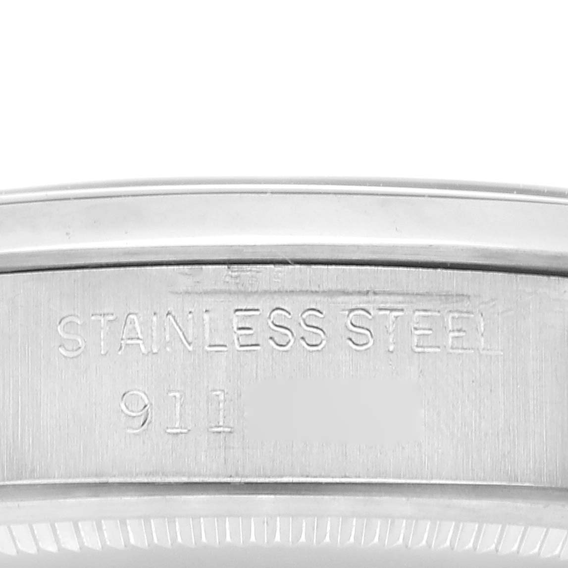 This image shows a close-up view of the side casing of a Vintage Collection Rolex watch, highlighting the stainless steel material.