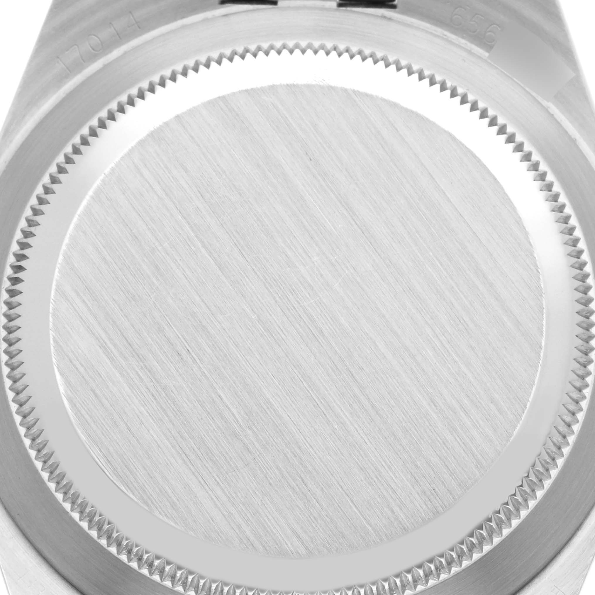 The image shows the case back of a Rolex Oysterquartz 17014 Men's Stainless Steel Silver Dial 17014 Men's Stainless Steel Silver Dial watch from a top-down angle.
