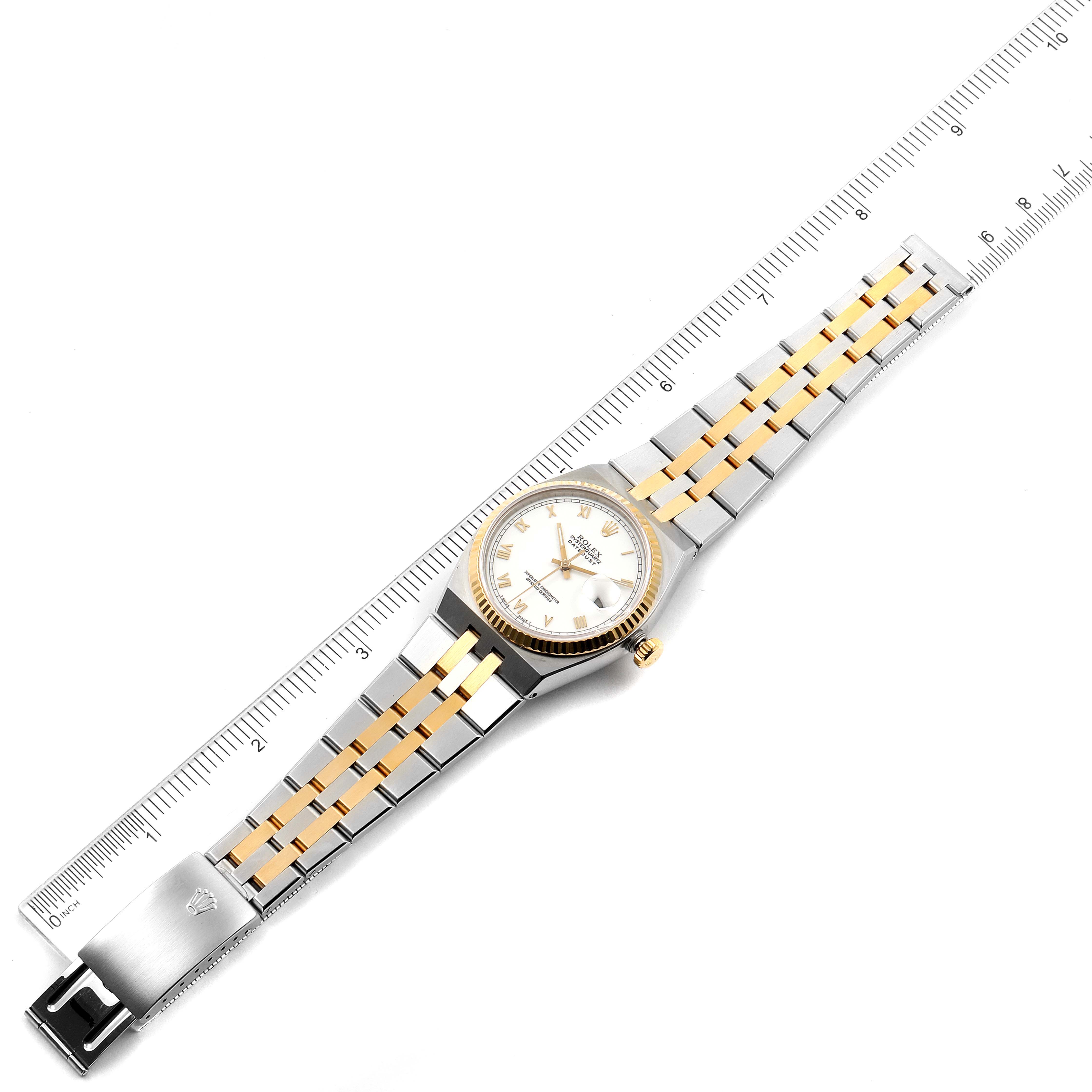 The image shows a Rolex Oysterquartz 17013 Men's Steel and Gold (two tone) White Dial 17013 Men's Steel and Gold (two tone) White Dial watch with a jubilee bracelet, face, and bezel laid flat, measured against a ruler.