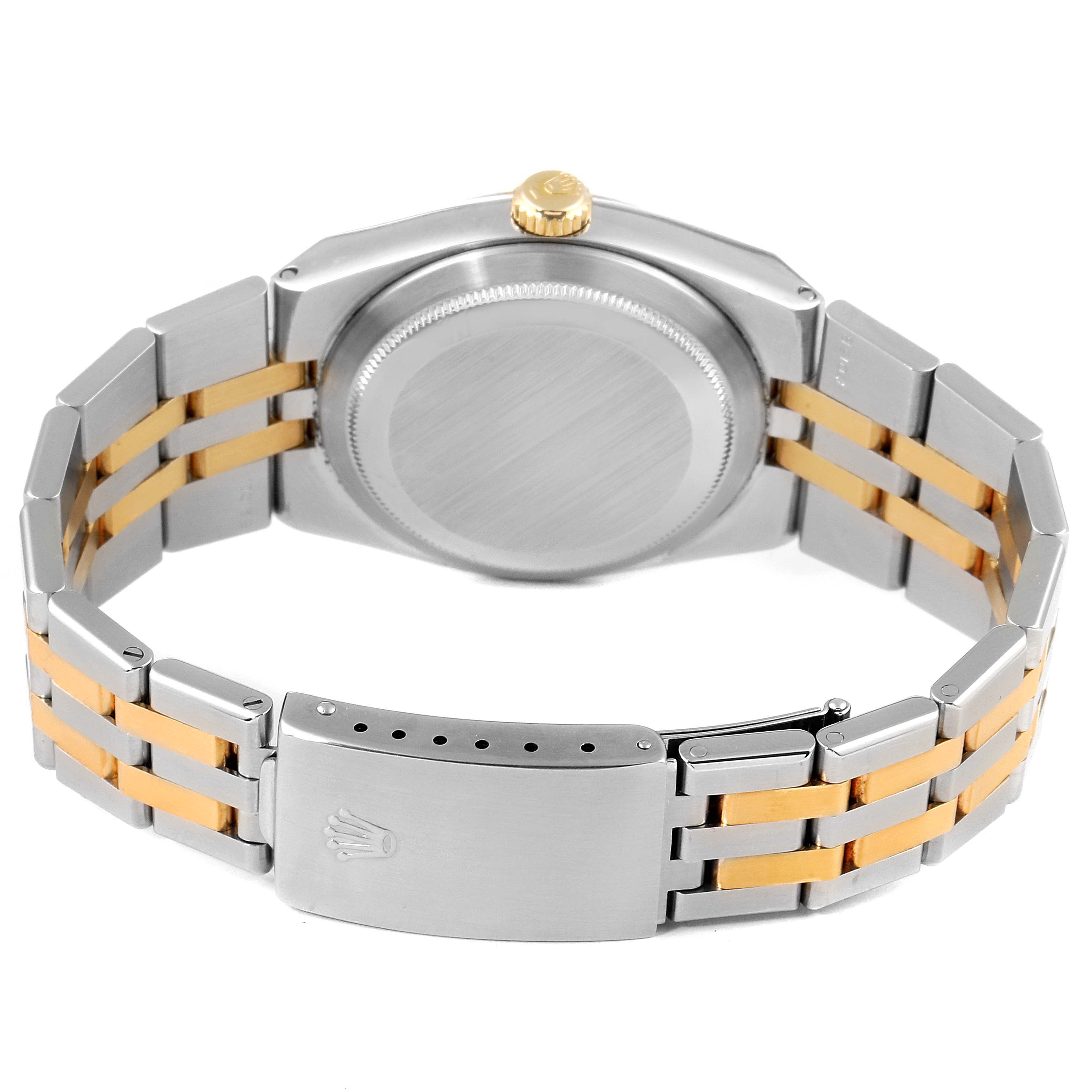This image shows the back view of a Rolex Oysterquartz 17013 Men's Steel and Gold (two tone) White Dial 17013 Men's Steel and Gold (two tone) White Dial watch, displaying its stainless steel and gold bracelet and closed clasp.