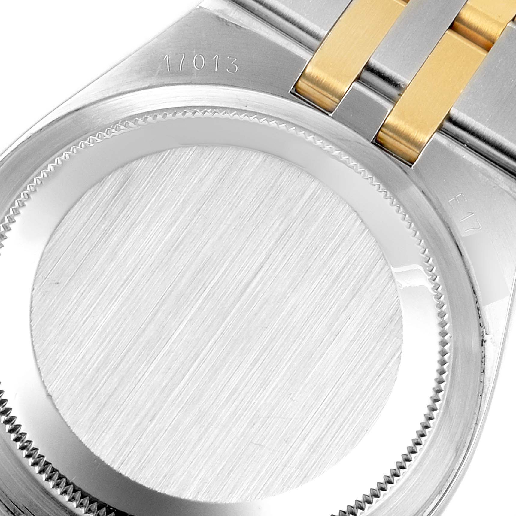 This image shows the back case and part of the bracelet of a Rolex Oysterquartz 17013 Men's Steel and Gold (two tone) White Dial 17013 Men's Steel and Gold (two tone) White Dial watch, model 17013.