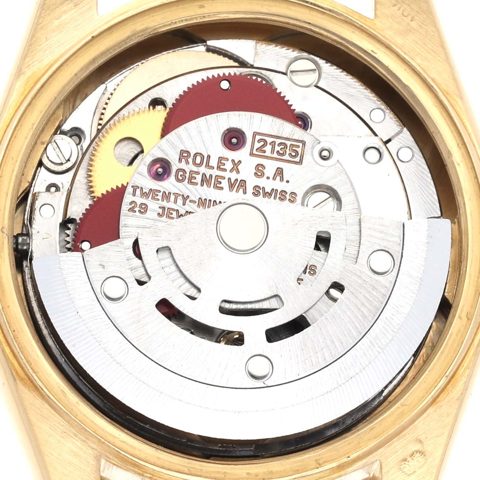 The image shows the internal mechanism of a Rolex President 69178 Women's Yellow Gold Black Dial 69178 Women's Yellow Gold Black Dial model, viewed from the back, featuring gears and the rotor.