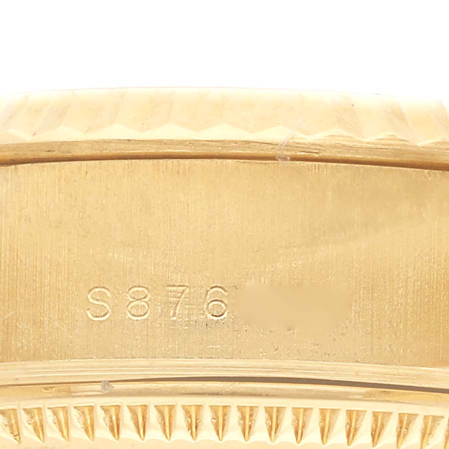 The image shows a close-up of the serial number and edge detailing on a Rolex President 69178 Women's Yellow Gold Black Dial 69178 Women's Yellow Gold Black Dial model watch bezel.