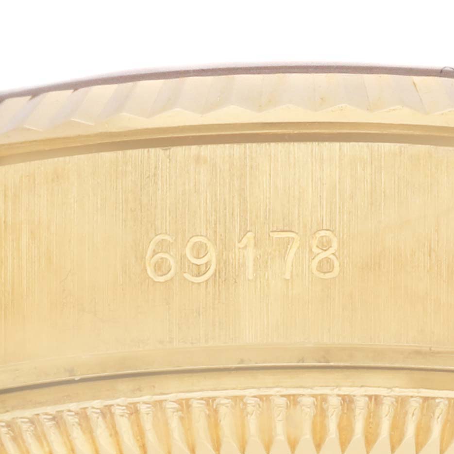 The image shows a close-up of the side of a Rolex President 69178 Women's Yellow Gold Champagne Dial 69178 Women's Yellow Gold Champagne Dial model case with the model number 69178 engraved.