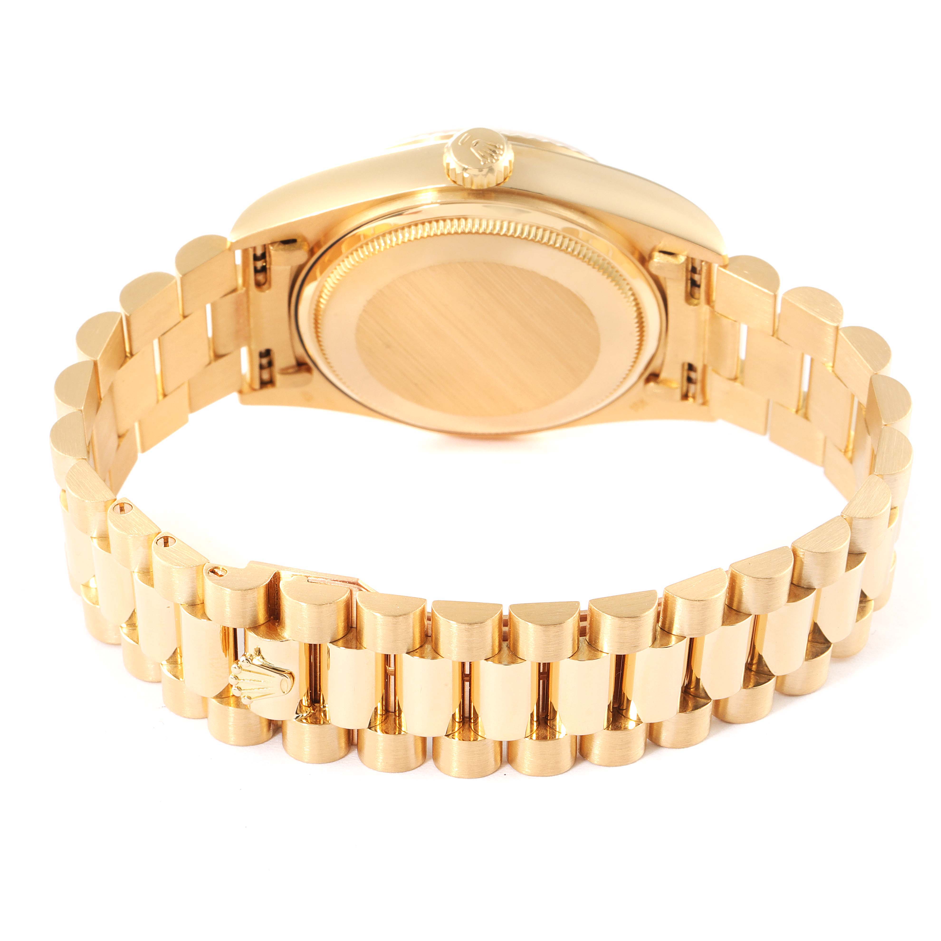 This image shows the back case and the bracelet of a Rolex President 18038 Men's Yellow Gold Champagne Dial 18038 Men's Yellow Gold Champagne Dial model watch from a top-down angle.