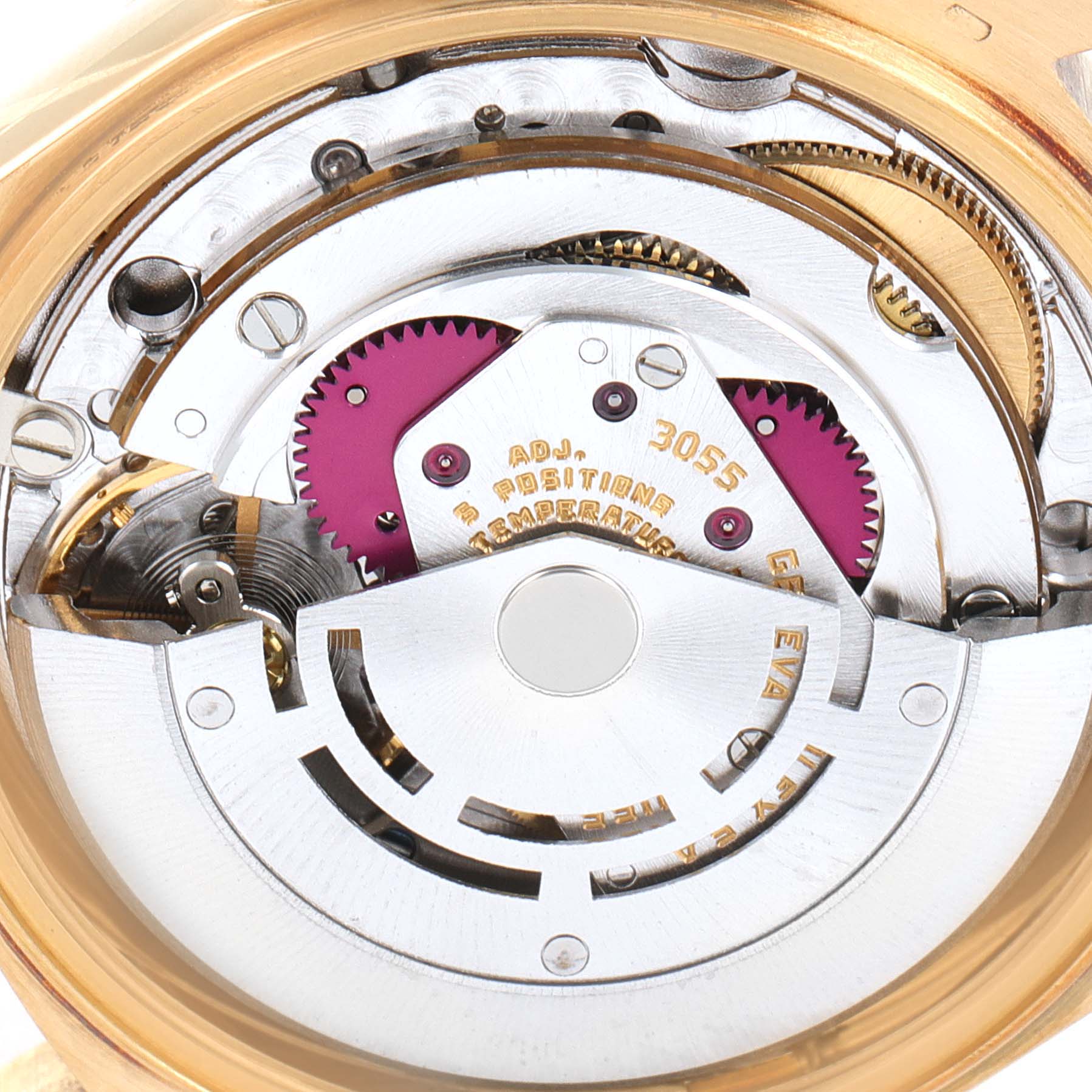 This image shows a close-up view of the inner mechanisms of a Rolex President 18038 Men's Yellow Gold Champagne Dial 18038 Men's Yellow Gold Champagne Dial model watch, including gears and the rotor assembly.