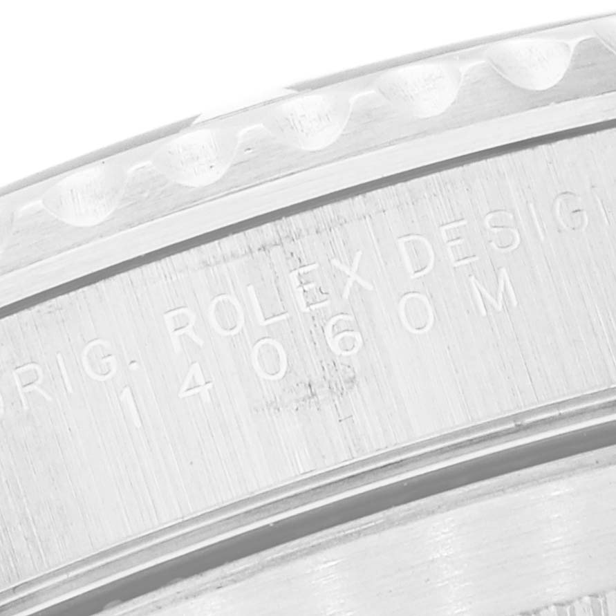 This image shows a close-up of the case-back and model number engraving of a Rolex Submariner 14060M Men's Stainless Steel Black Dial 14060M Men's Stainless Steel Black Dial.