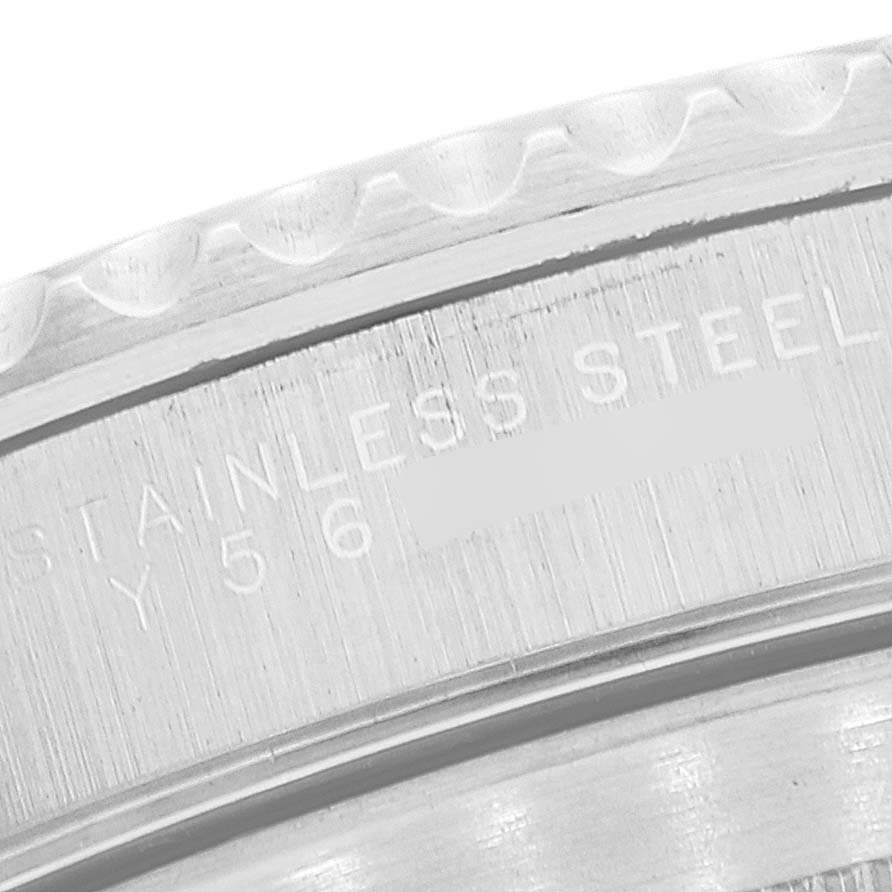 The image shows a close-up of the stainless steel back of a Rolex Submariner 14060M Men's Stainless Steel Black Dial 14060M Men's Stainless Steel Black Dial watch, highlighting its engraving.