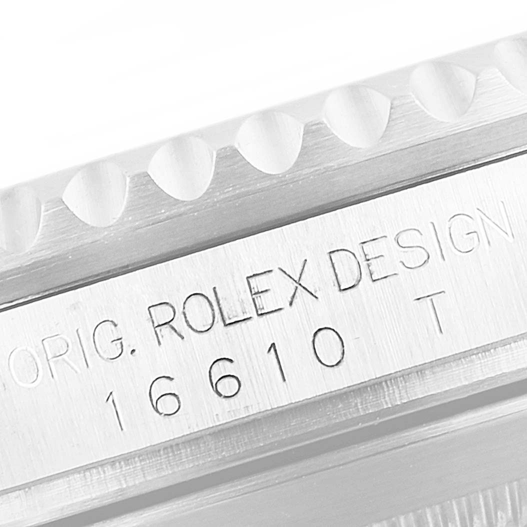 The image shows a close-up of the case side engravings on a Rolex Submariner 16610 Men's Stainless Steel Black Dial 16610 Men's Stainless Steel Black Dial watch, including model number 16610.