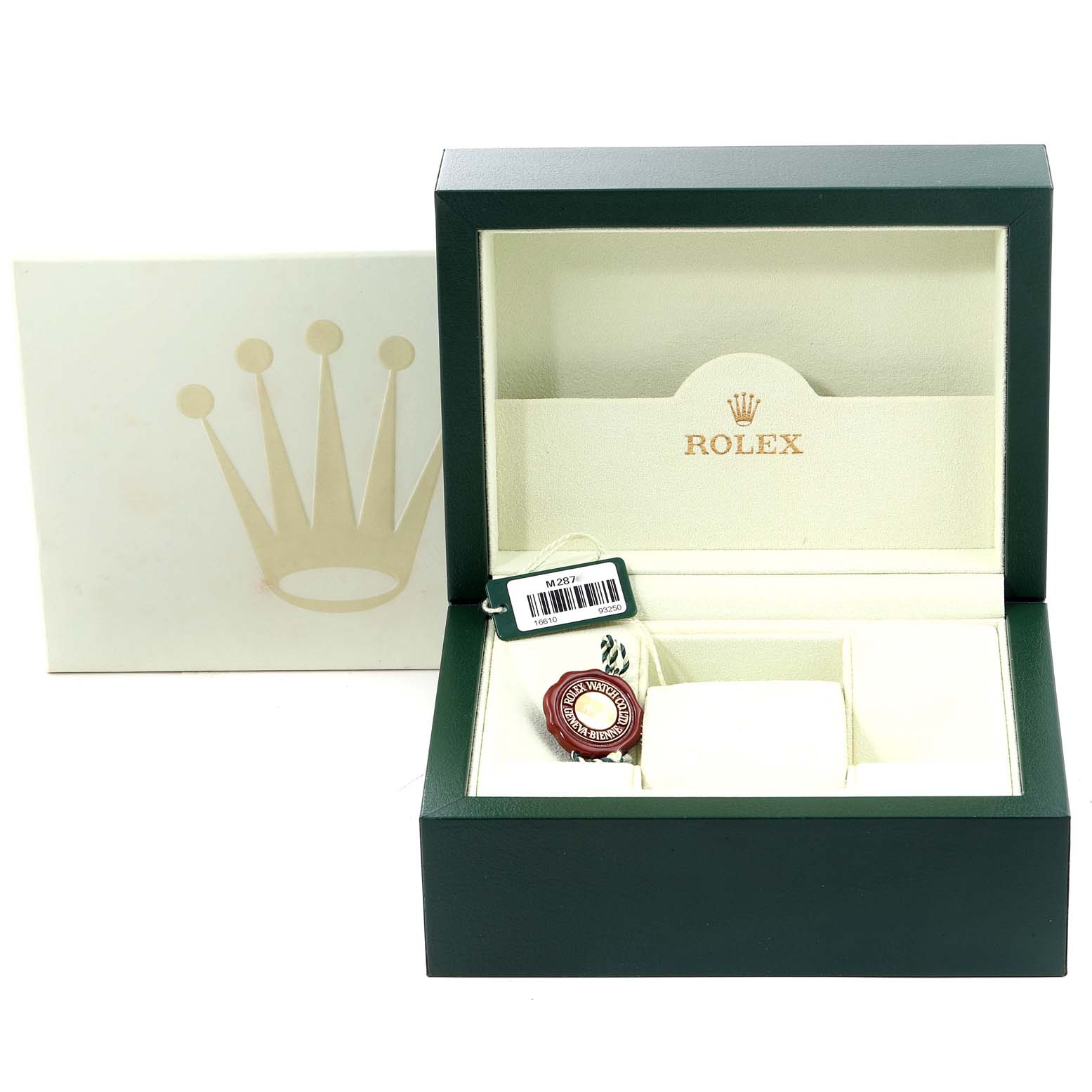 The image shows an open Rolex Submariner 16610 Men's Stainless Steel Black Dial 16610 Men's Stainless Steel Black Dial watch box with accessories, including a tag and cushion, viewed from the front.