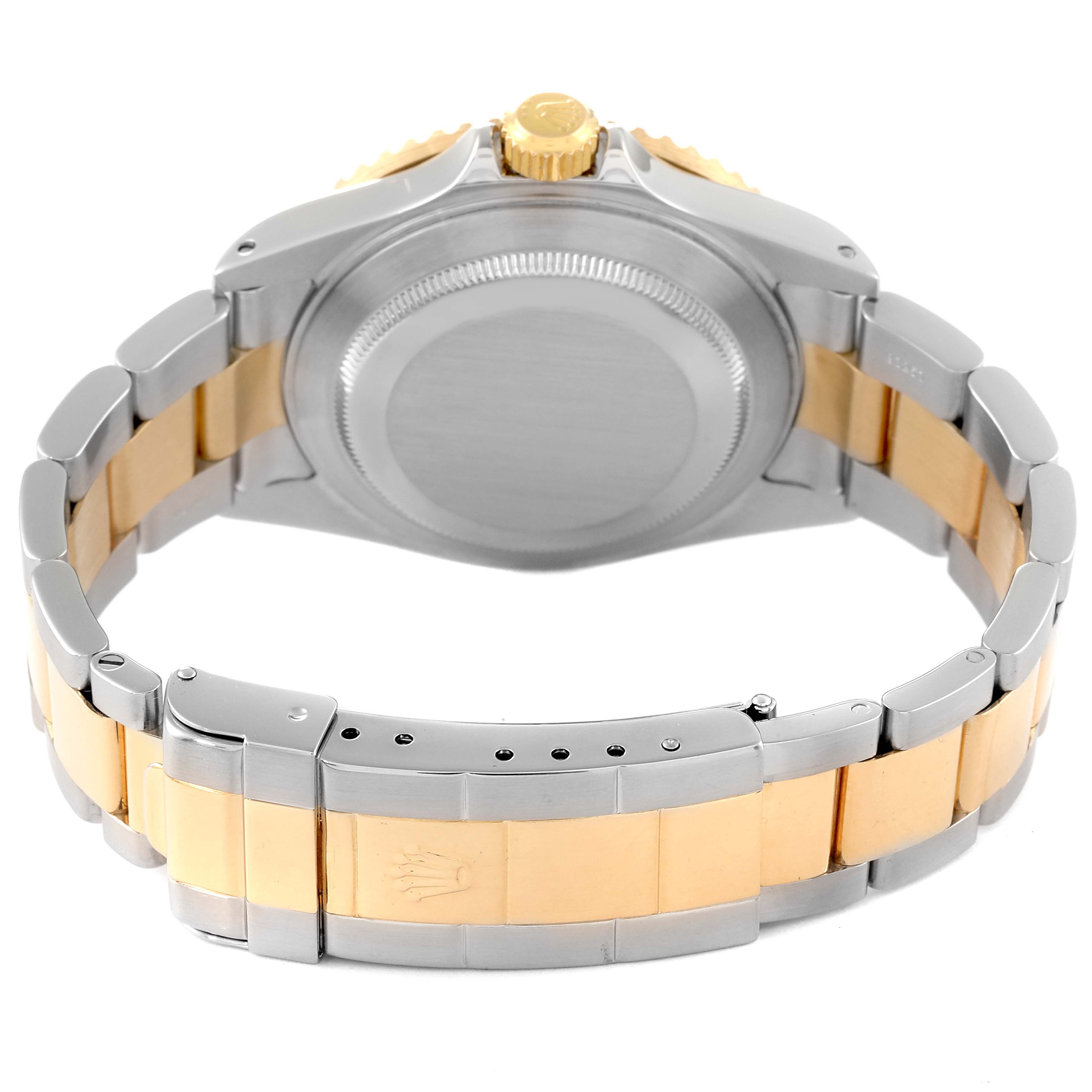 The image shows the back view of a Rolex Submariner 16613 Men's Steel and Gold (two tone) Blue Dial 16613 Men's Steel and Gold (two tone) Blue Dial watch, highlighting the clasp, bracelet, case back, and crown.