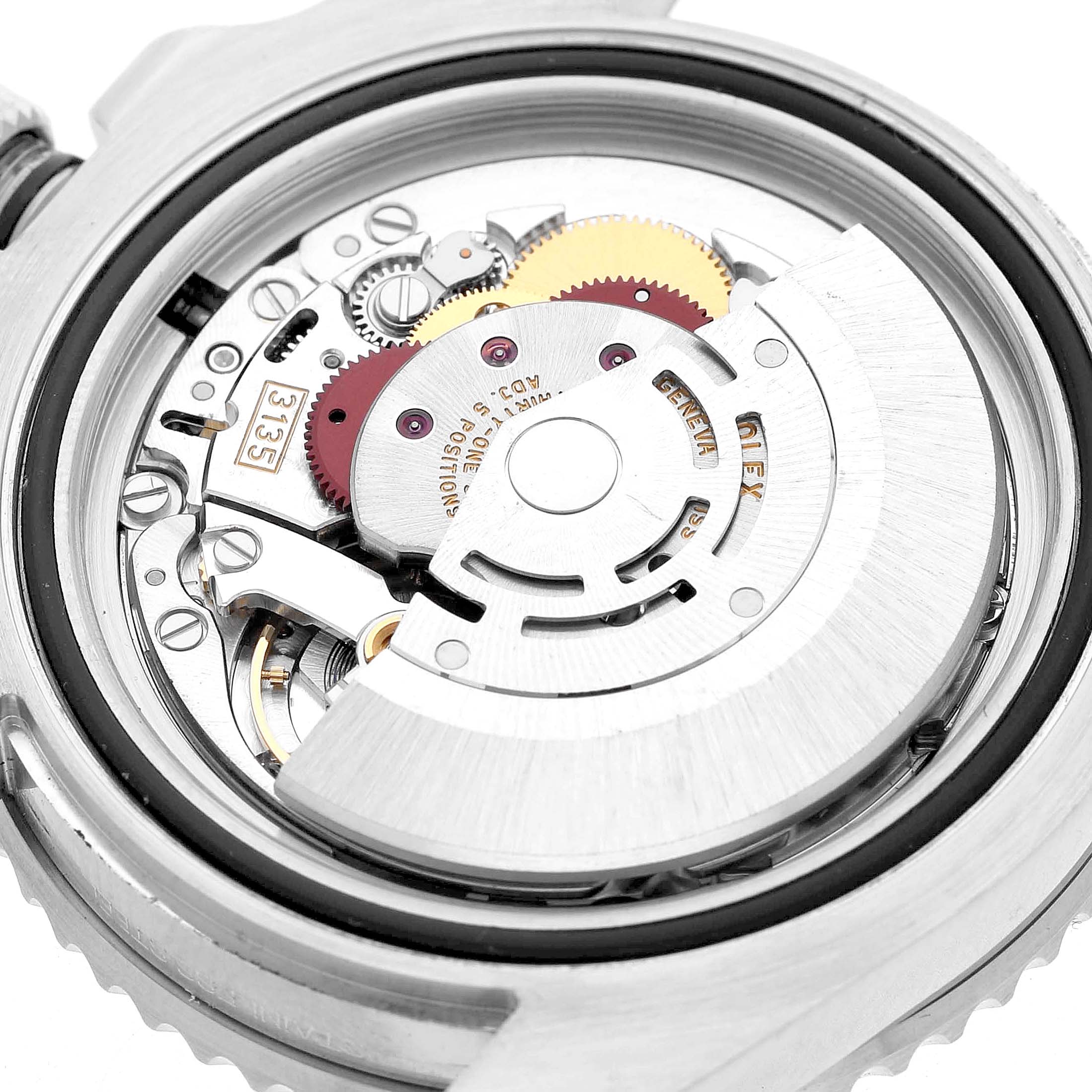 The image shows the movement of a Rolex Submariner 116610LV Men's Stainless Steel Green Dial watch from the back, highlighting gears and mechanical components.