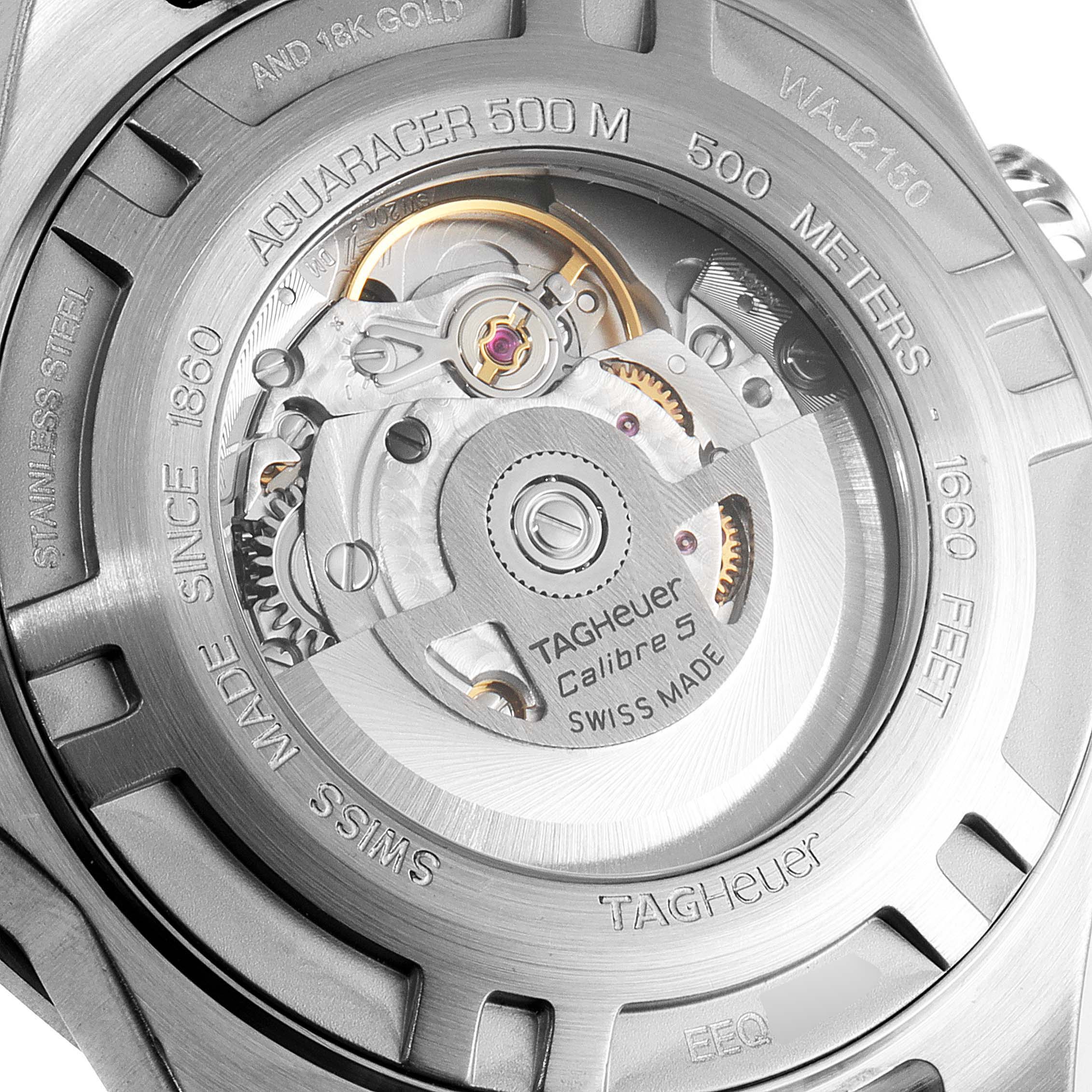 The image shows a close-up of the Tag Heuer Aquaracer WAJ2150.BA0870 Men
s Steel and Gold (two tone) Black Dial WAJ2150.BA0870 Men
s Steel and Gold (two tone) Black Dial model
s back casing, displaying its movement and specifications.
