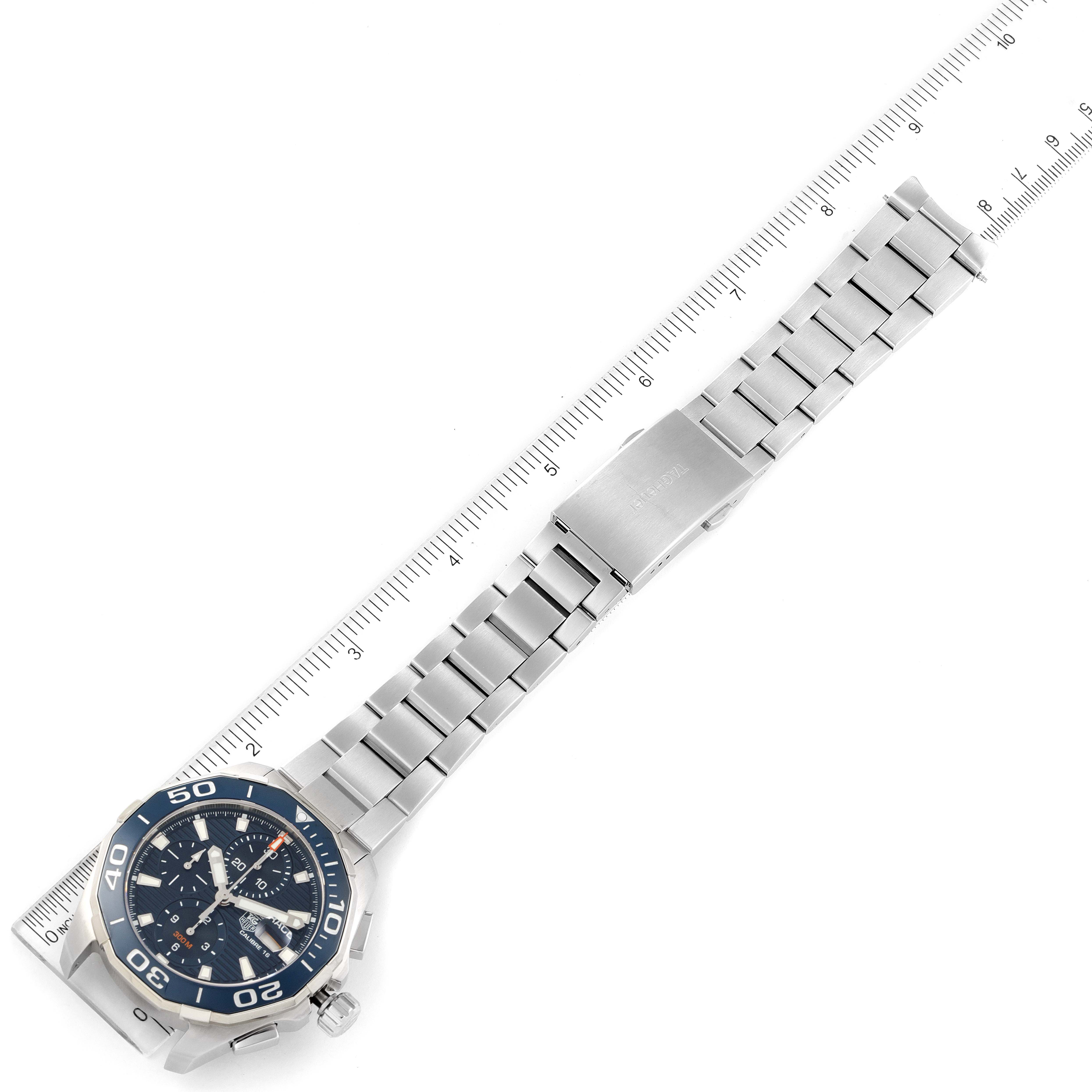 The image shows a Tag Heuer Aquaracer CAY211B.BA0927 Men's Stainless Steel Blue Dial CAY211B.BA0927 Men's Stainless Steel Blue Dial watch laid flat, with a ruler for size reference.