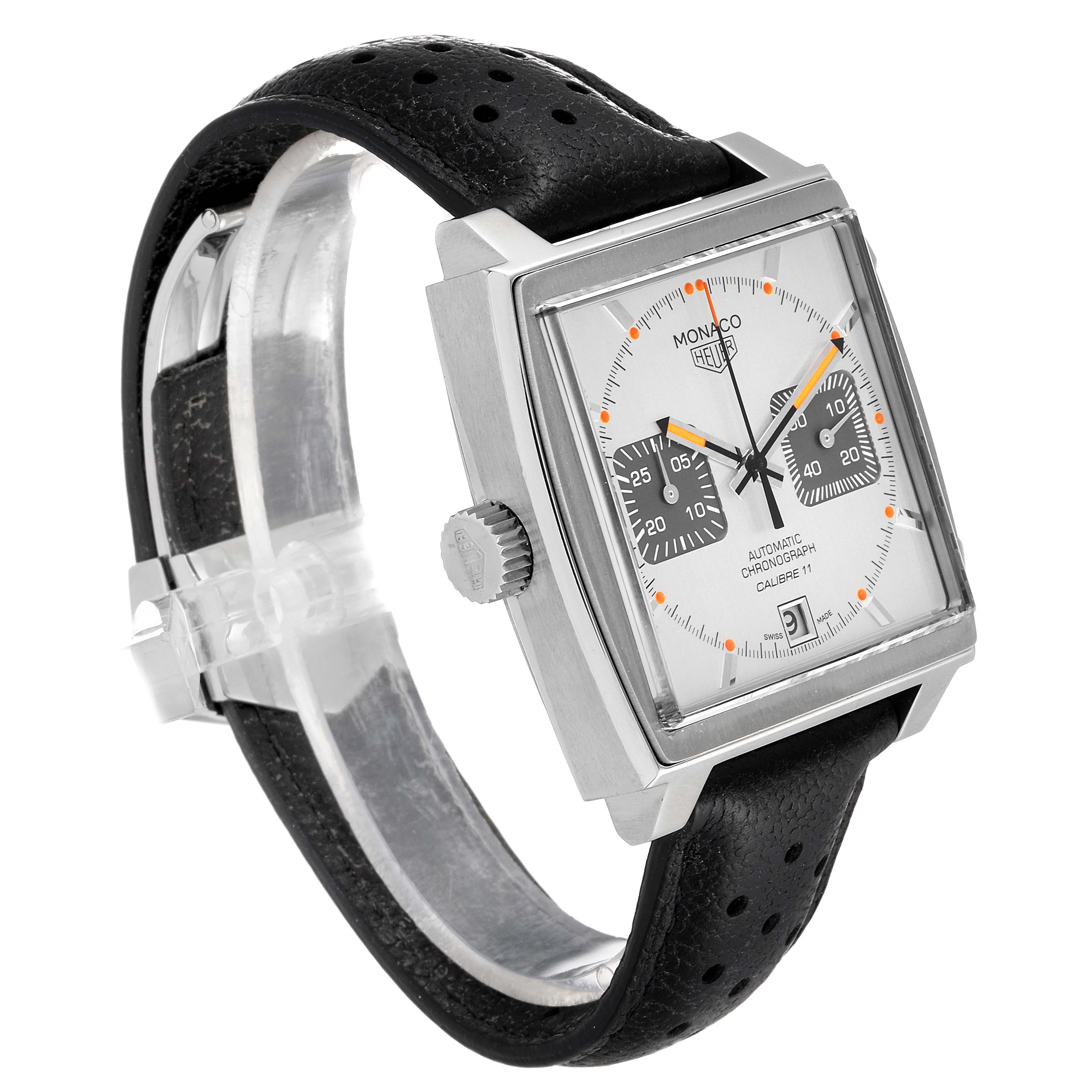 This Tag Heuer Monaco watch is shown at an angle highlighting the square face, dial, bezel, crown, and black perforated strap.